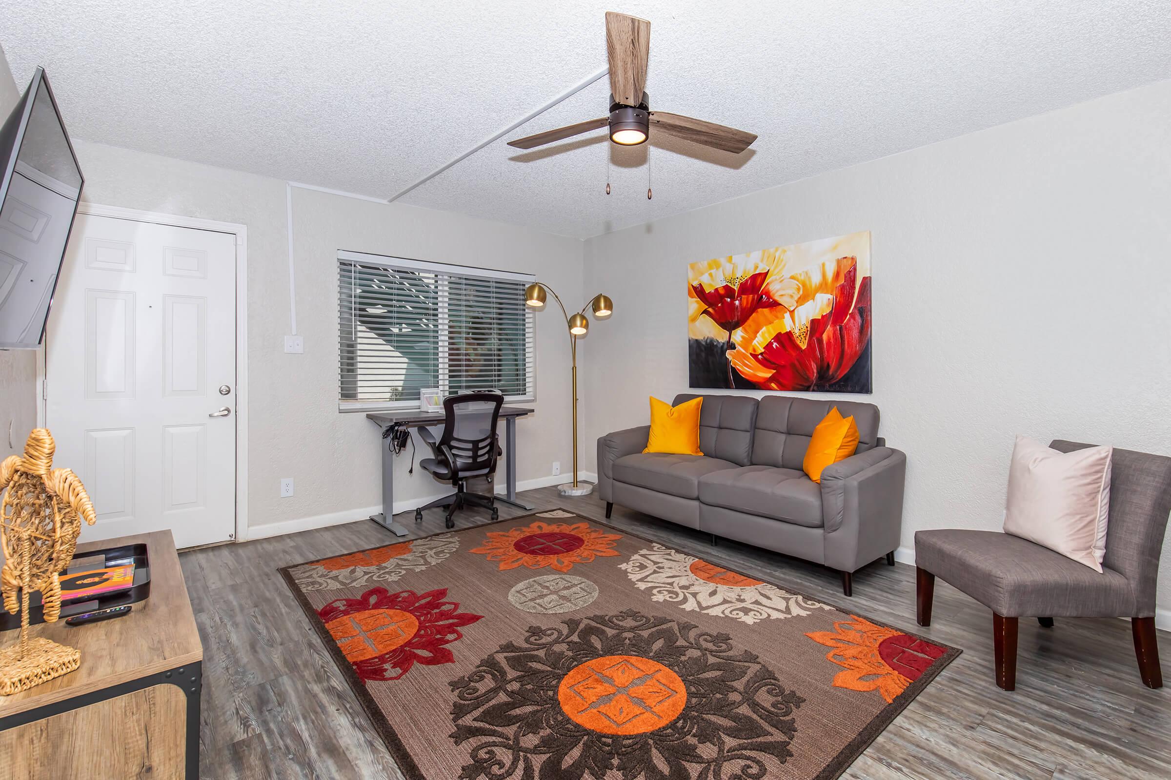 a living room filled with furniture and a fire place