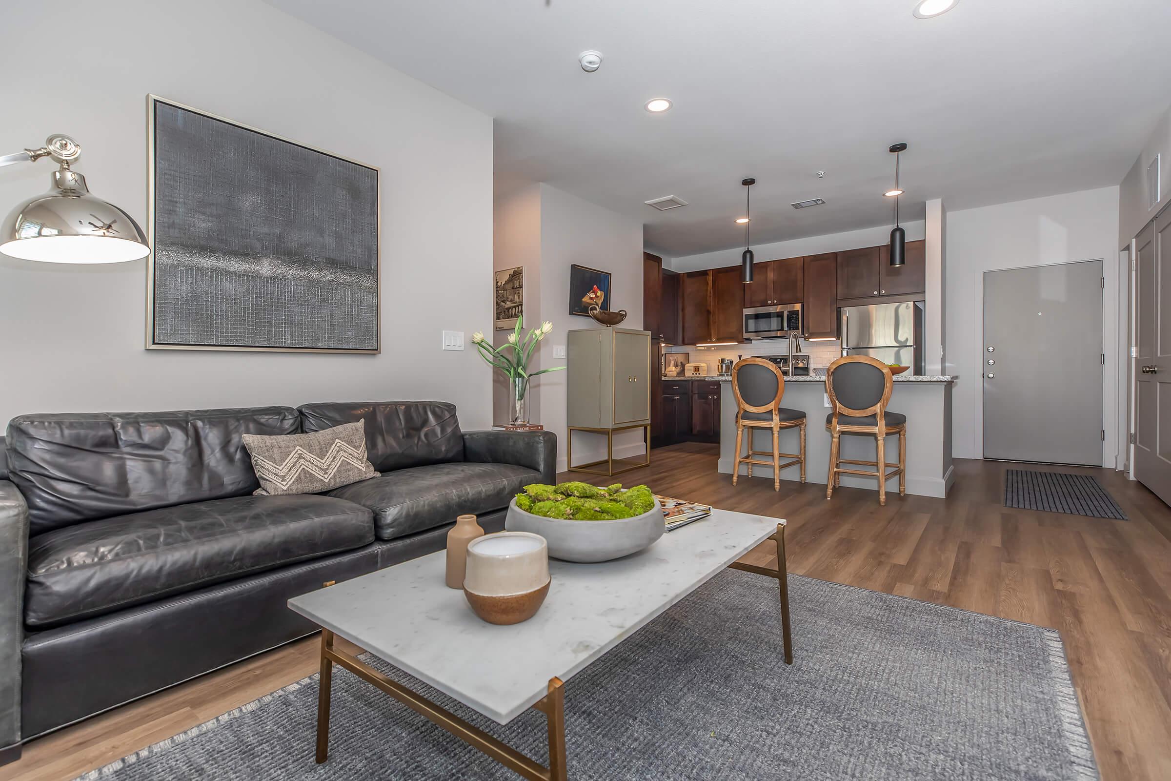 a living room filled with furniture and a flat screen tv