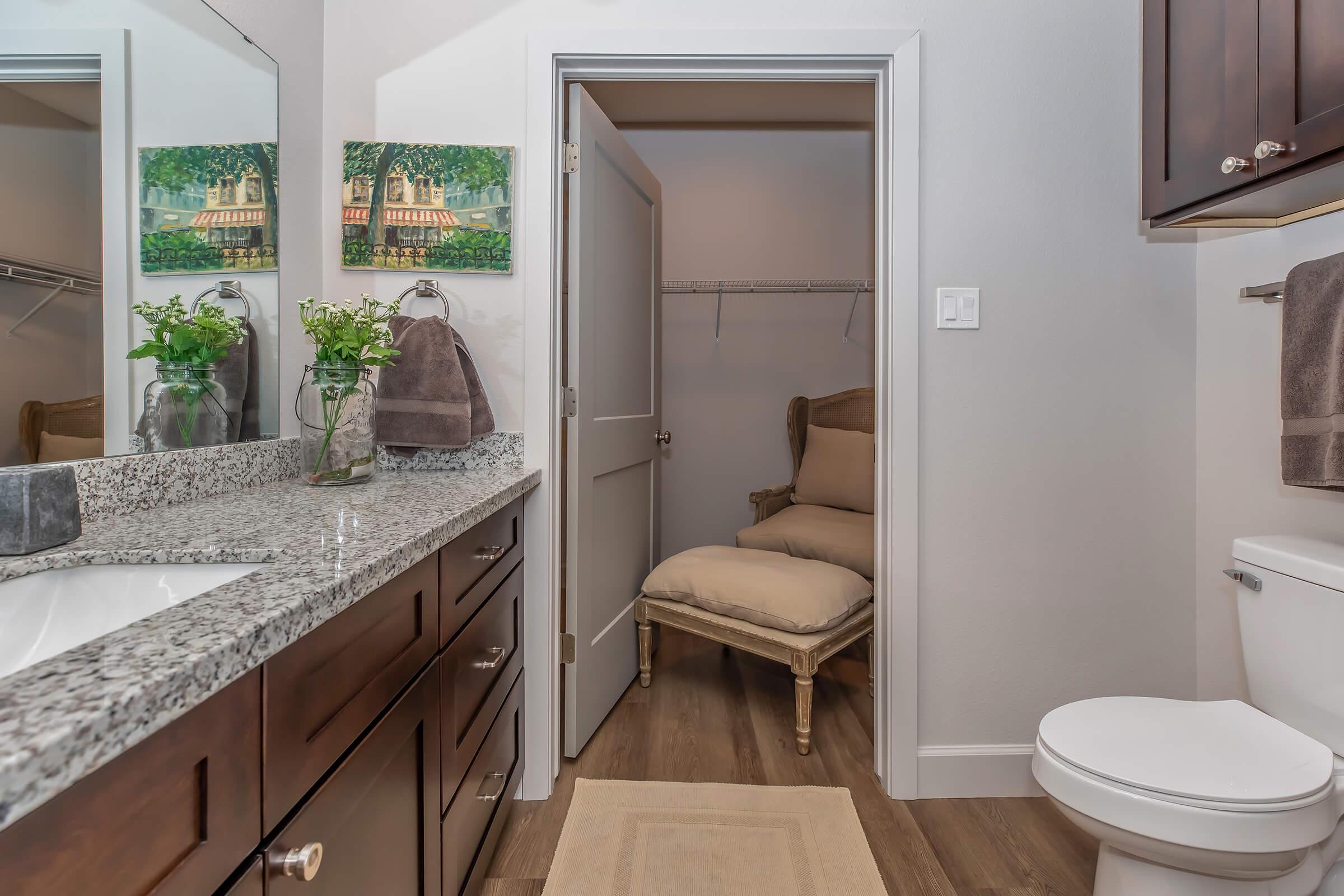 a room with a sink and a mirror