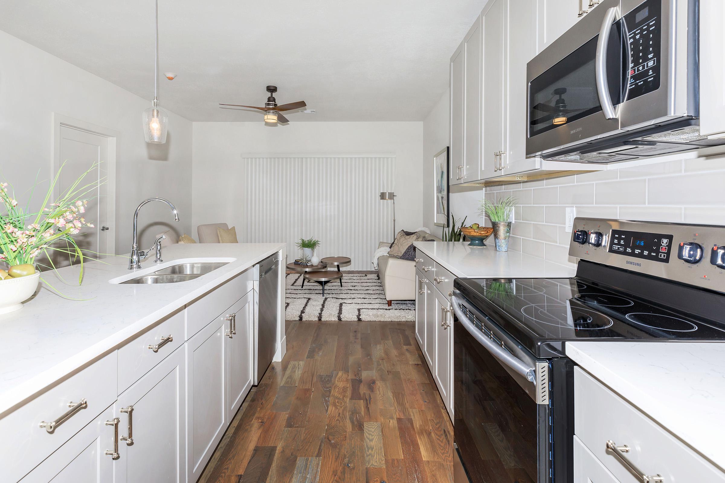 a kitchen with a stove and a sink