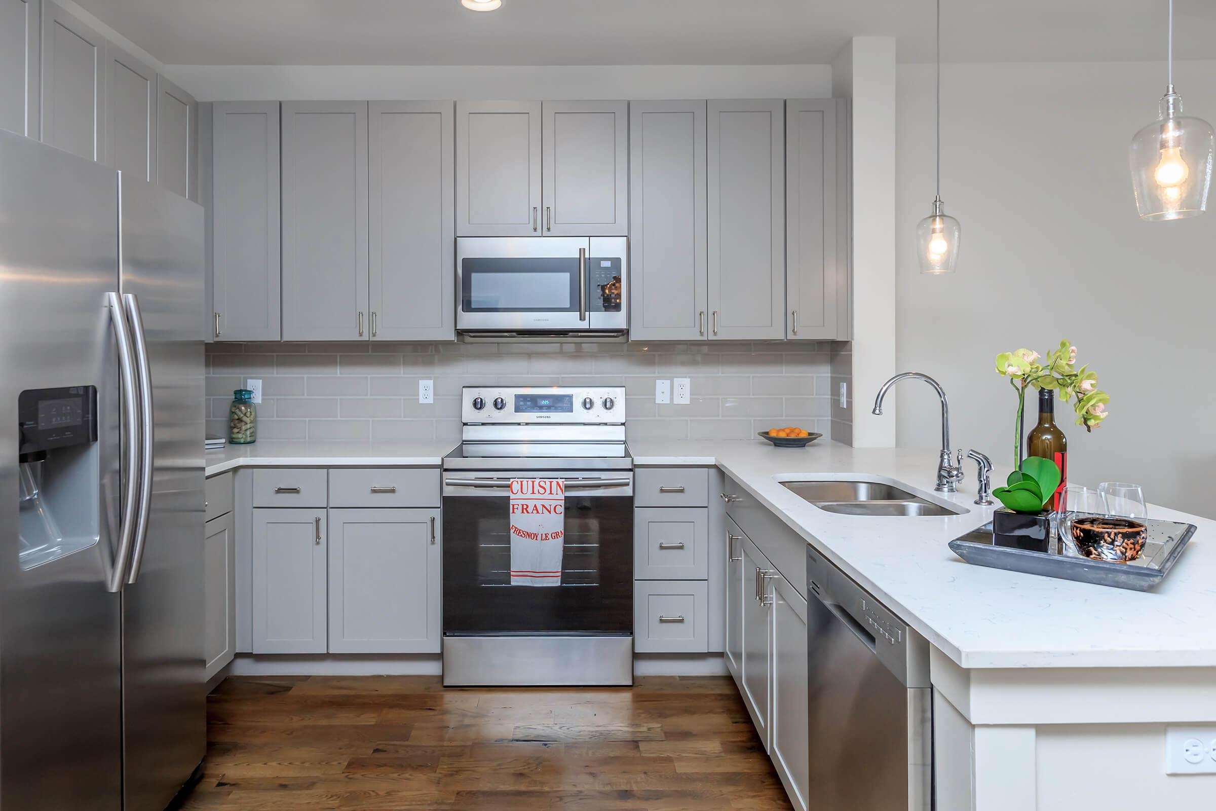 a modern kitchen with stainless steel appliances