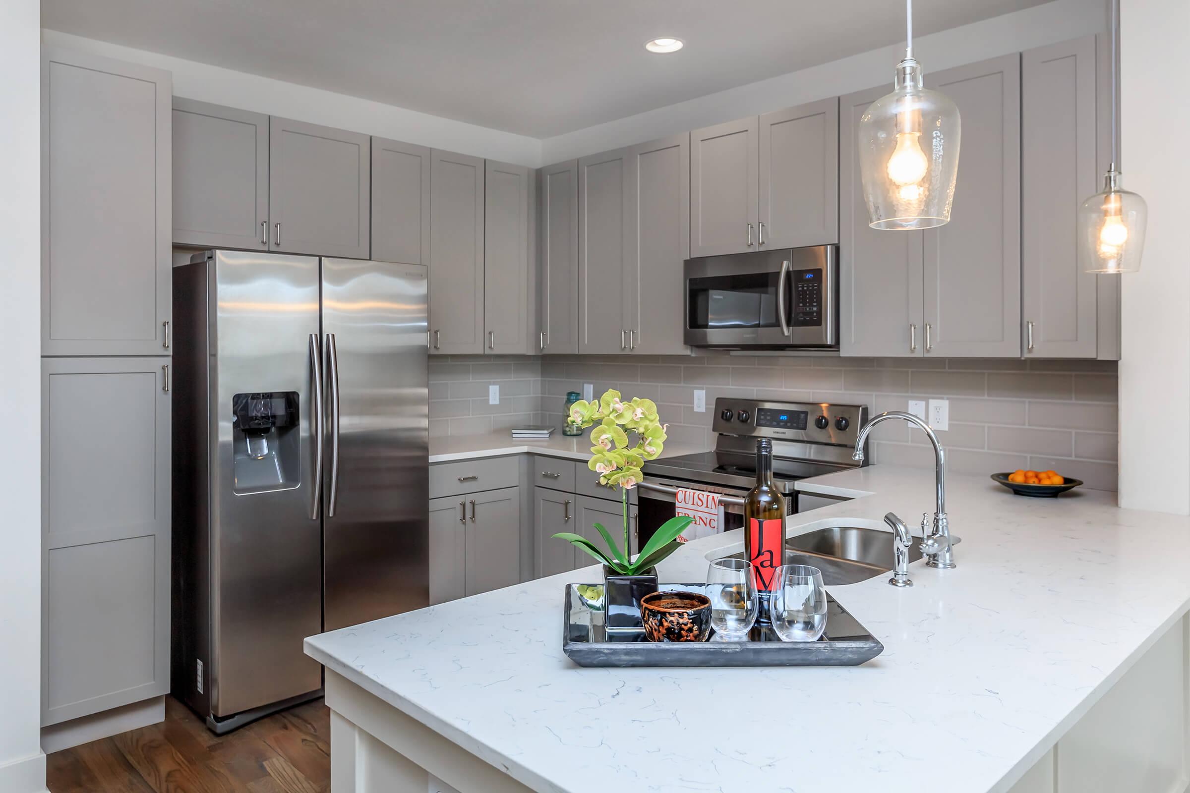 a modern kitchen with stainless steel appliances