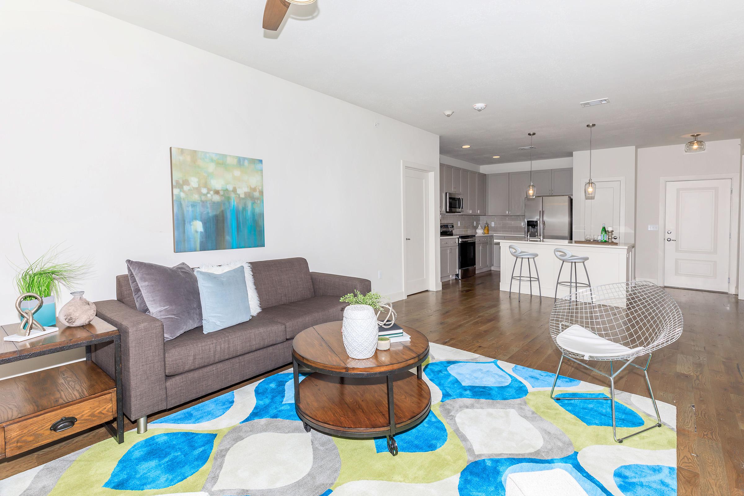 a living room filled with furniture and a table