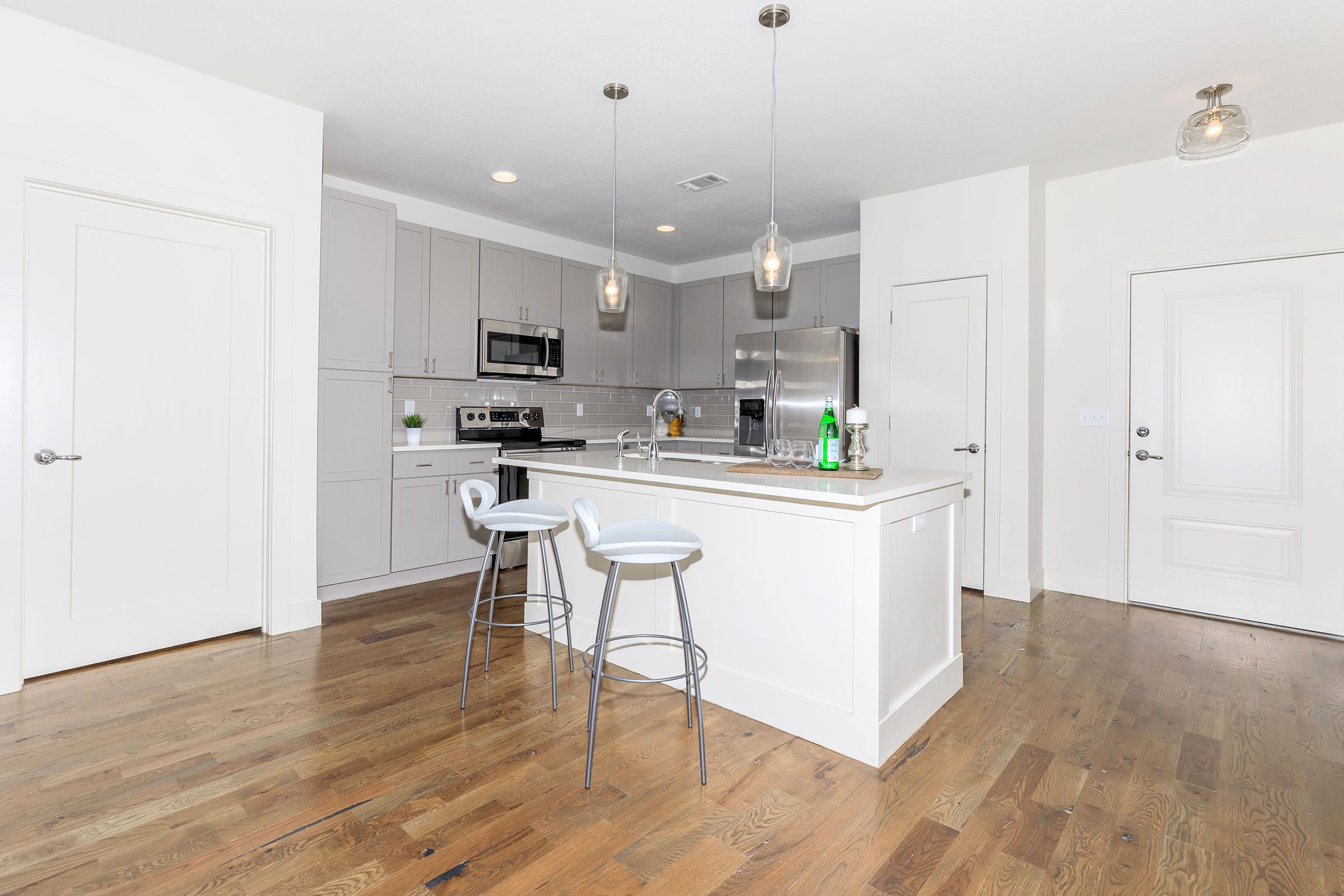 a kitchen with a wooden floor