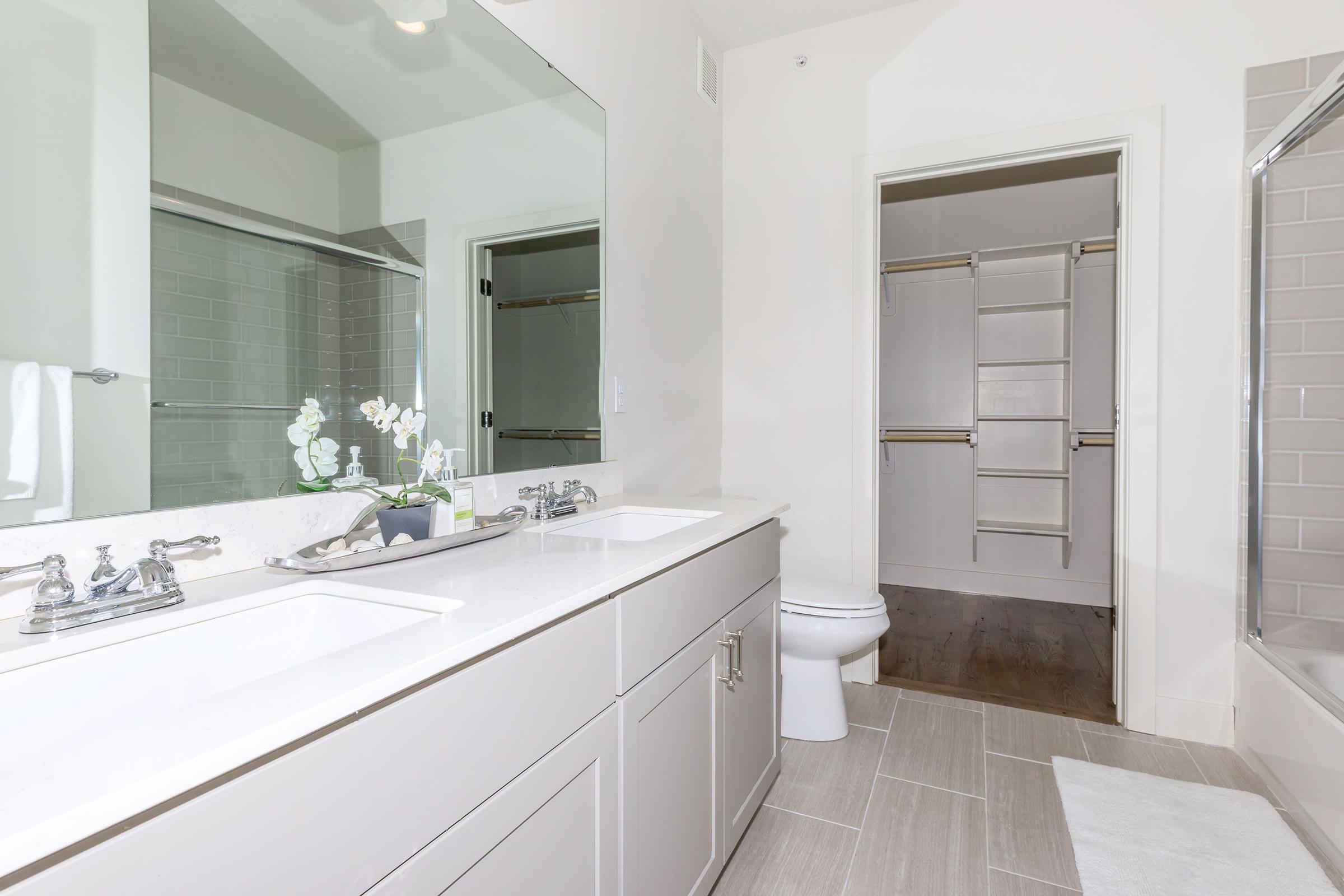 a kitchen with a sink and a mirror