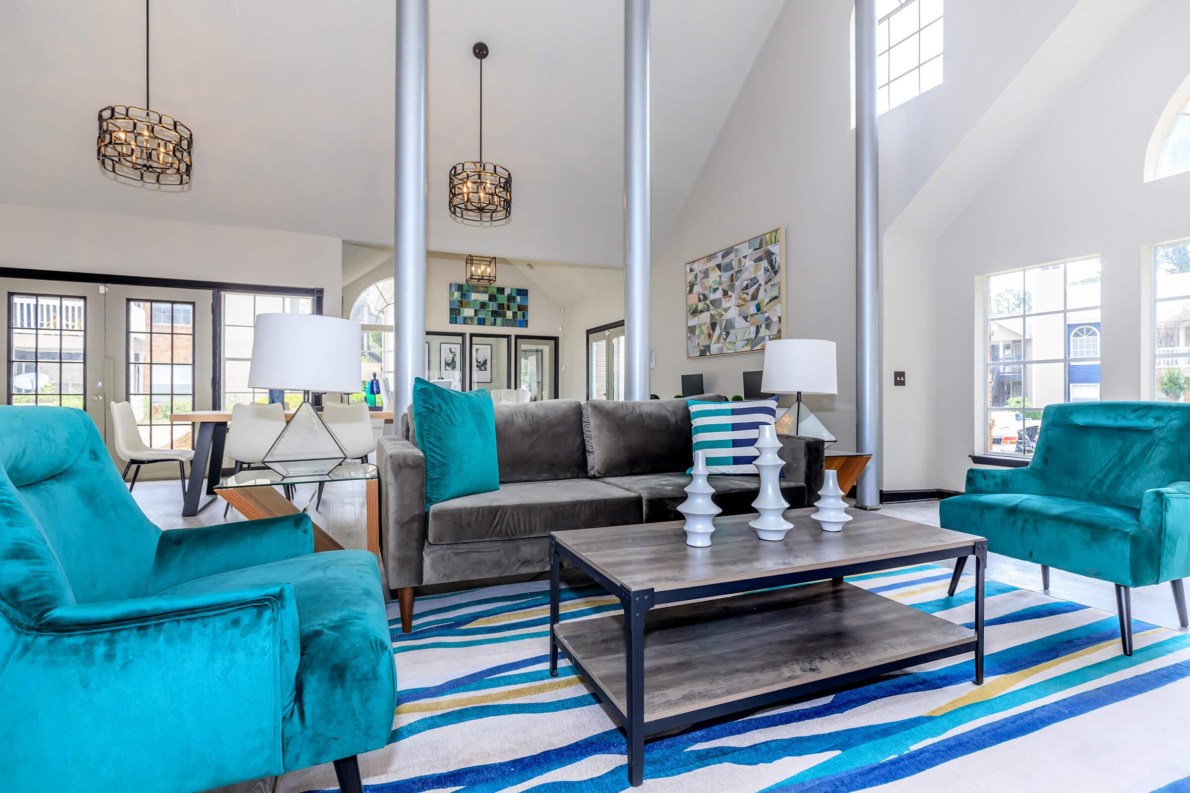 a living room filled with furniture and a large window