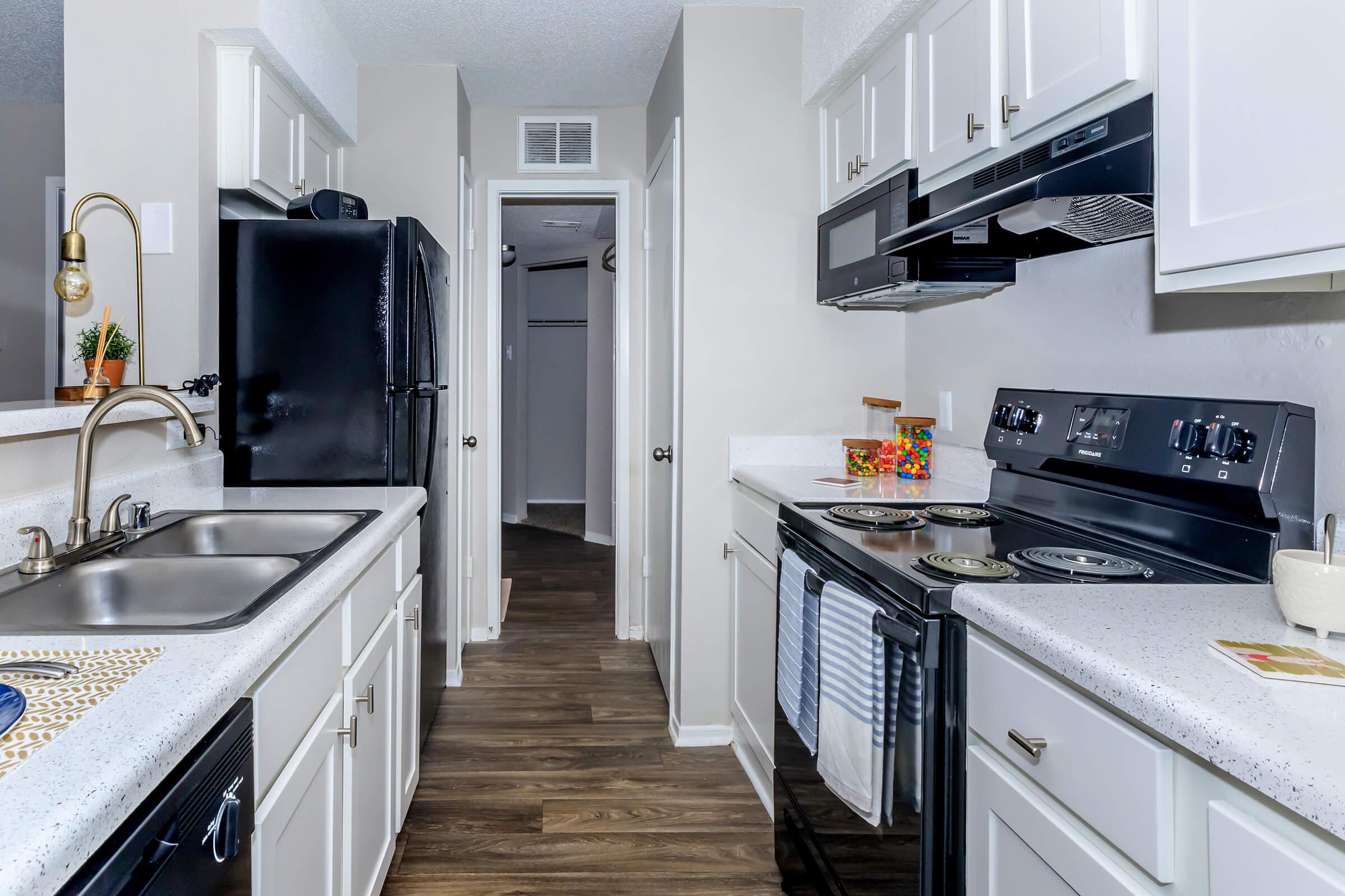 a kitchen with a stove and a sink