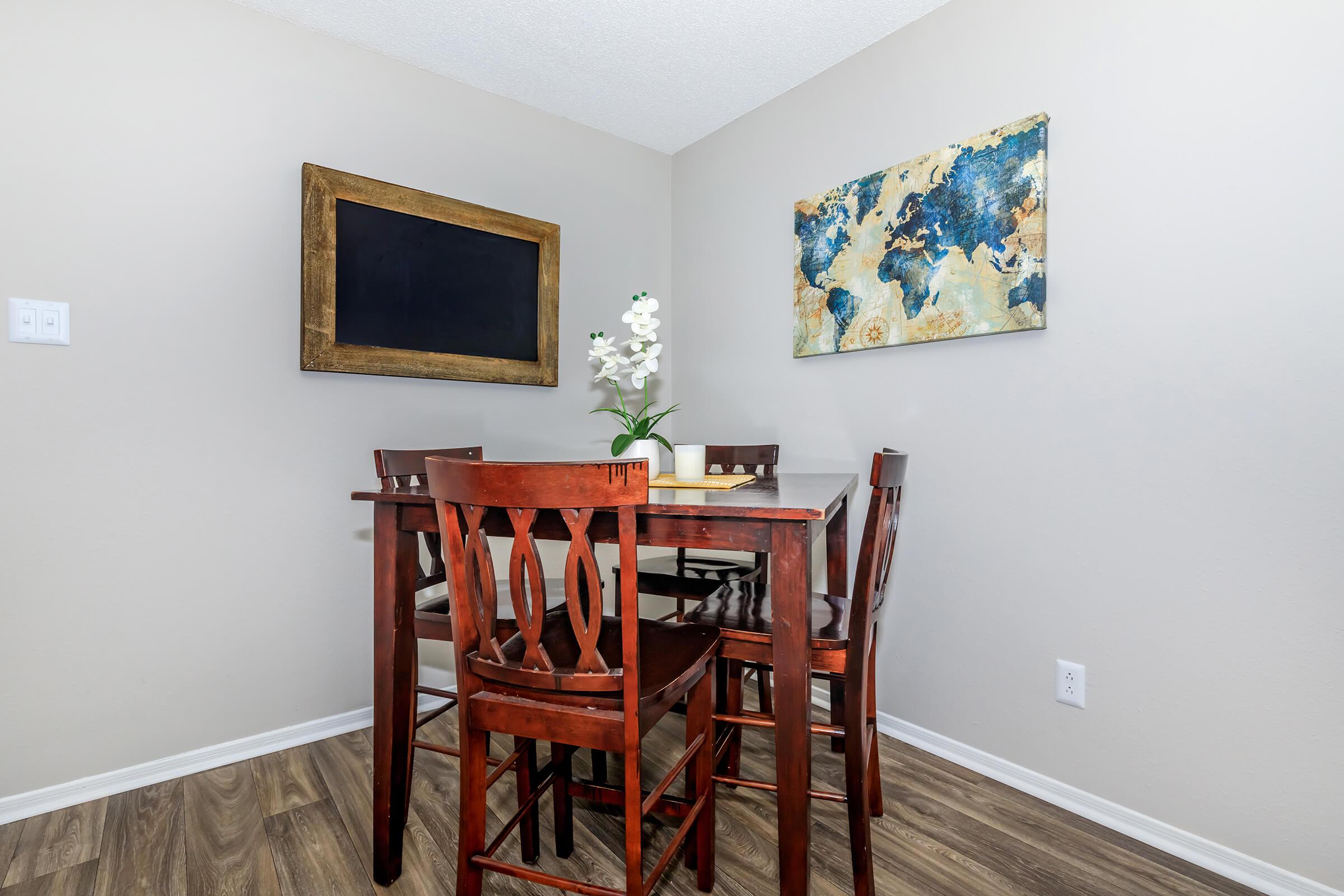 a bedroom with a bed and a chair in a room