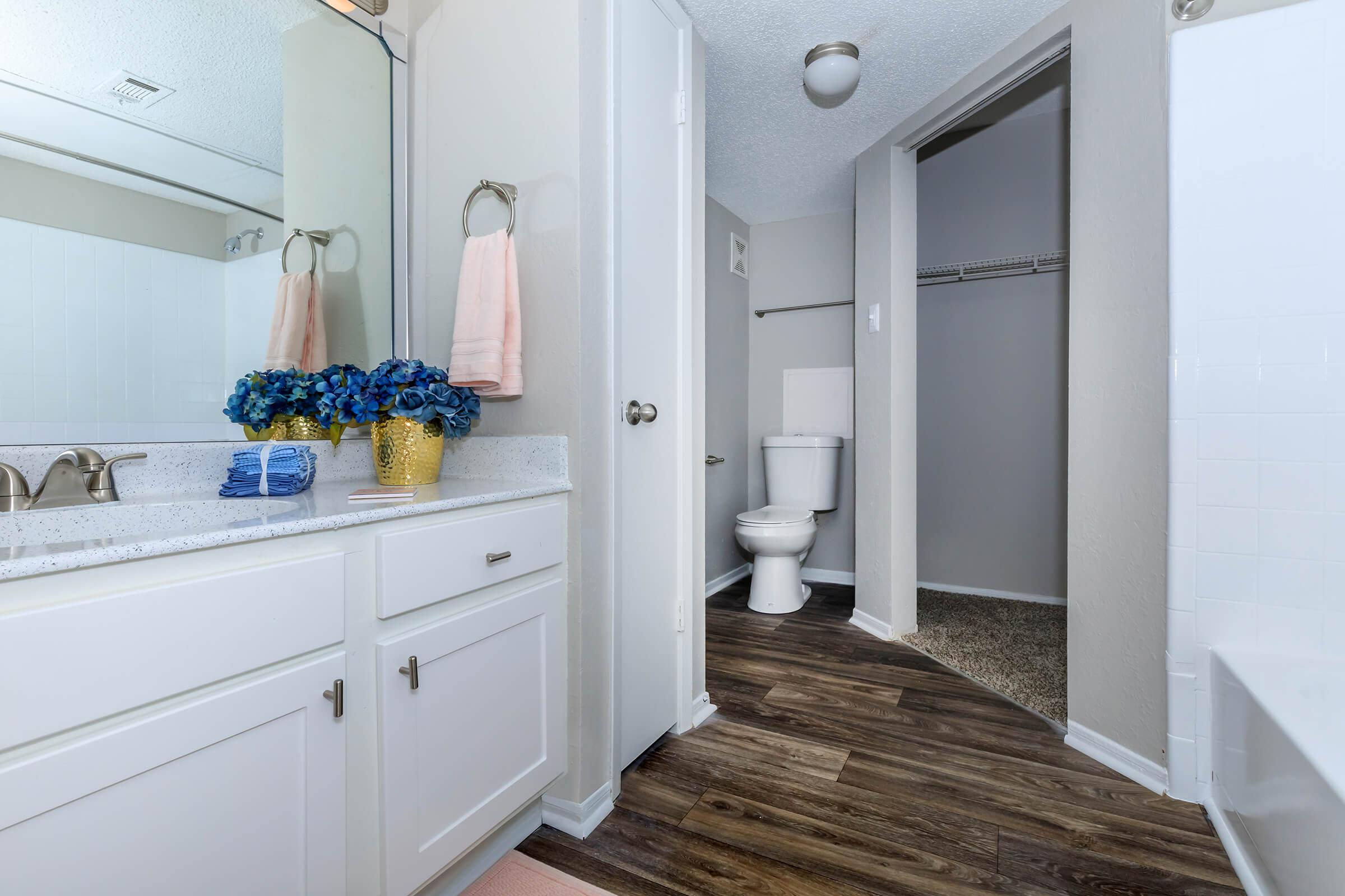 a kitchen with a sink and a mirror