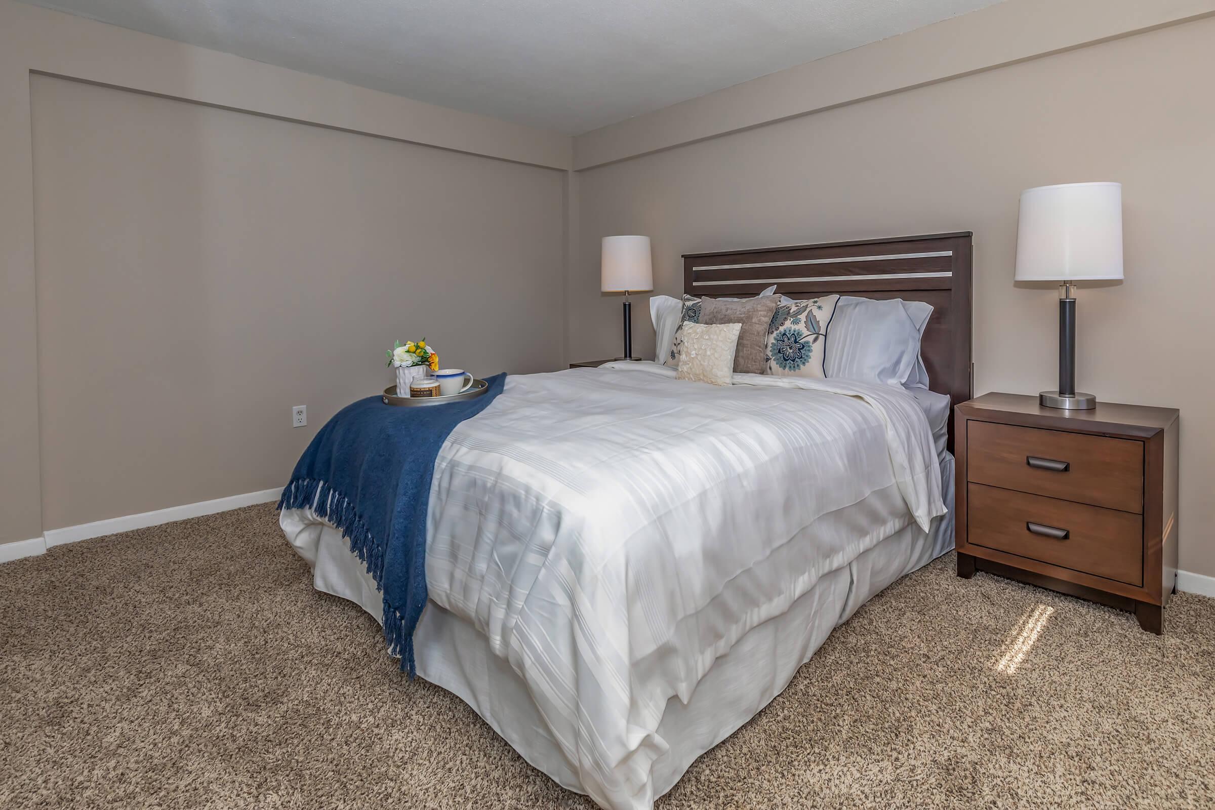 a bedroom with a bed in a hotel room