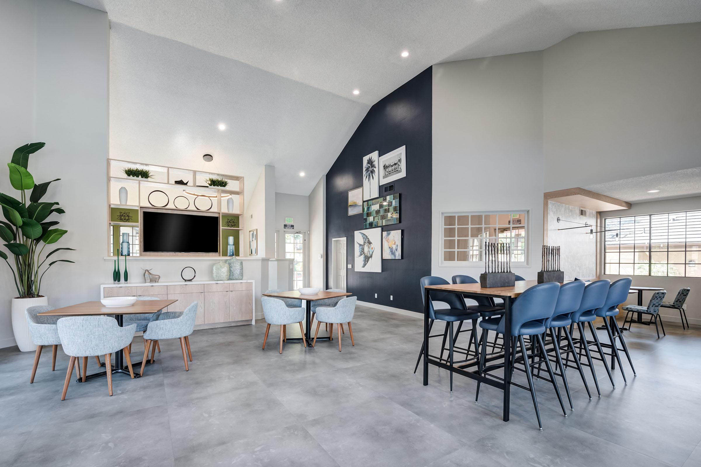 a living room filled with furniture and a table