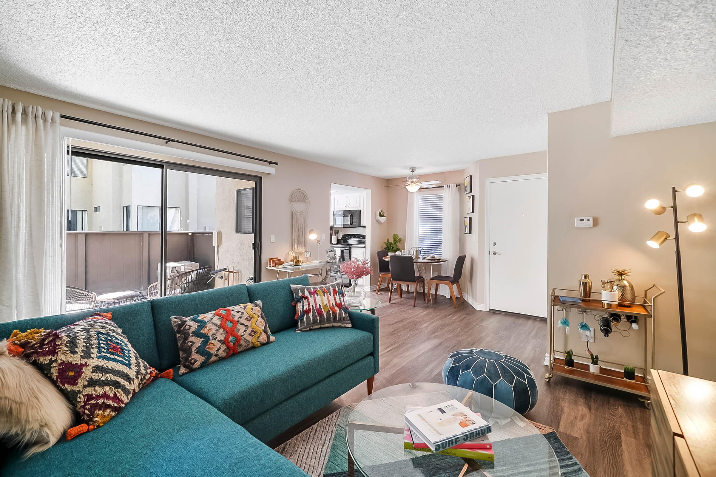 a living room with a green blanket