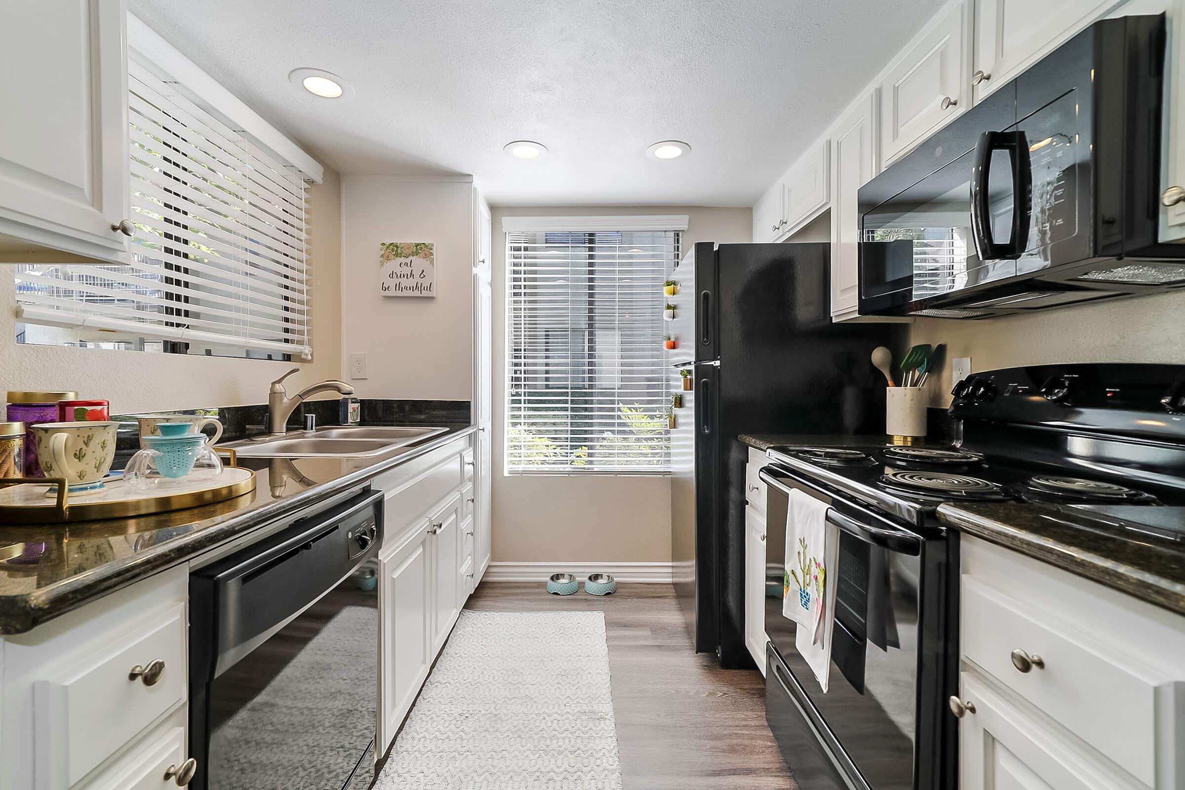 a modern kitchen with stainless steel appliances