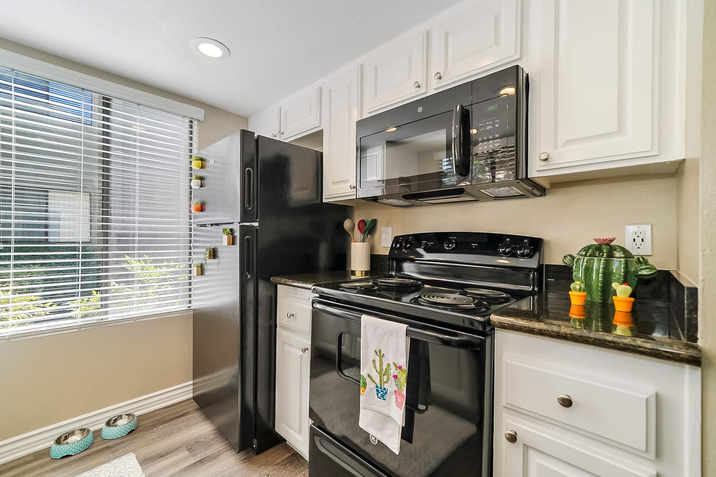 a large kitchen with stainless steel appliances