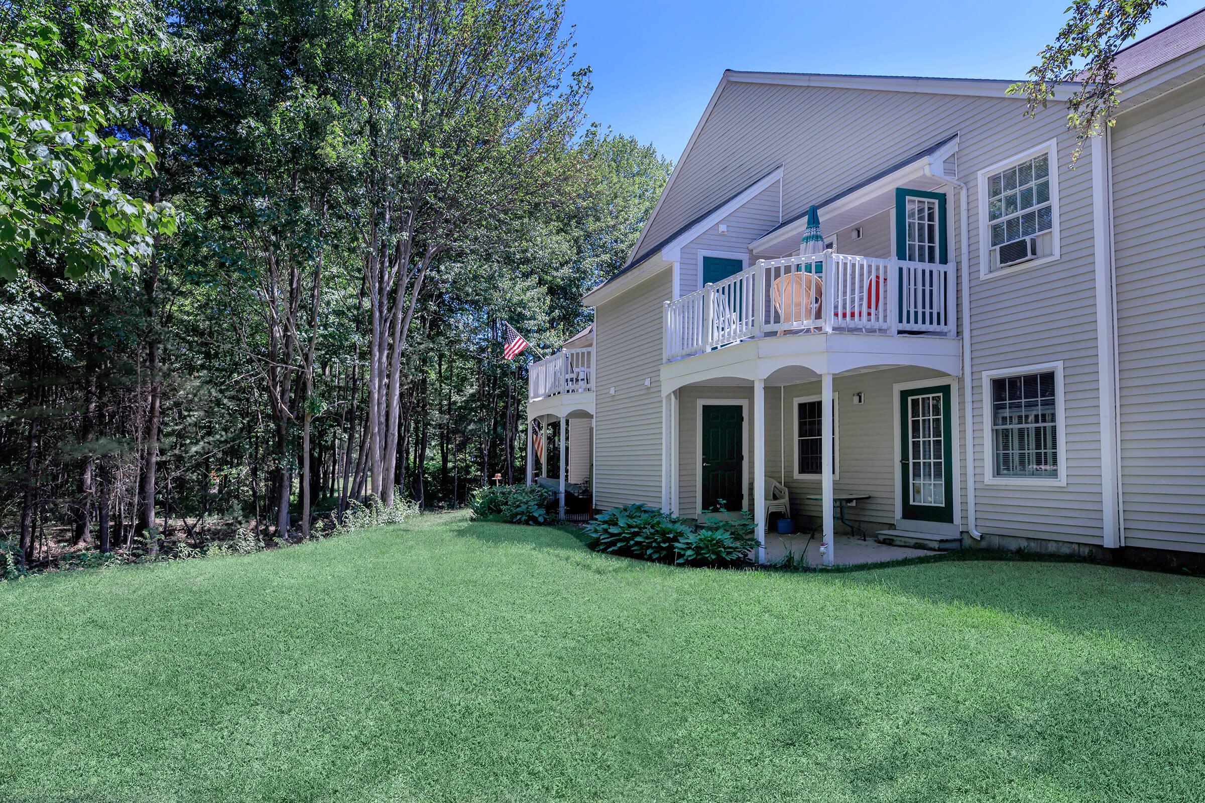 a large lawn in front of a house