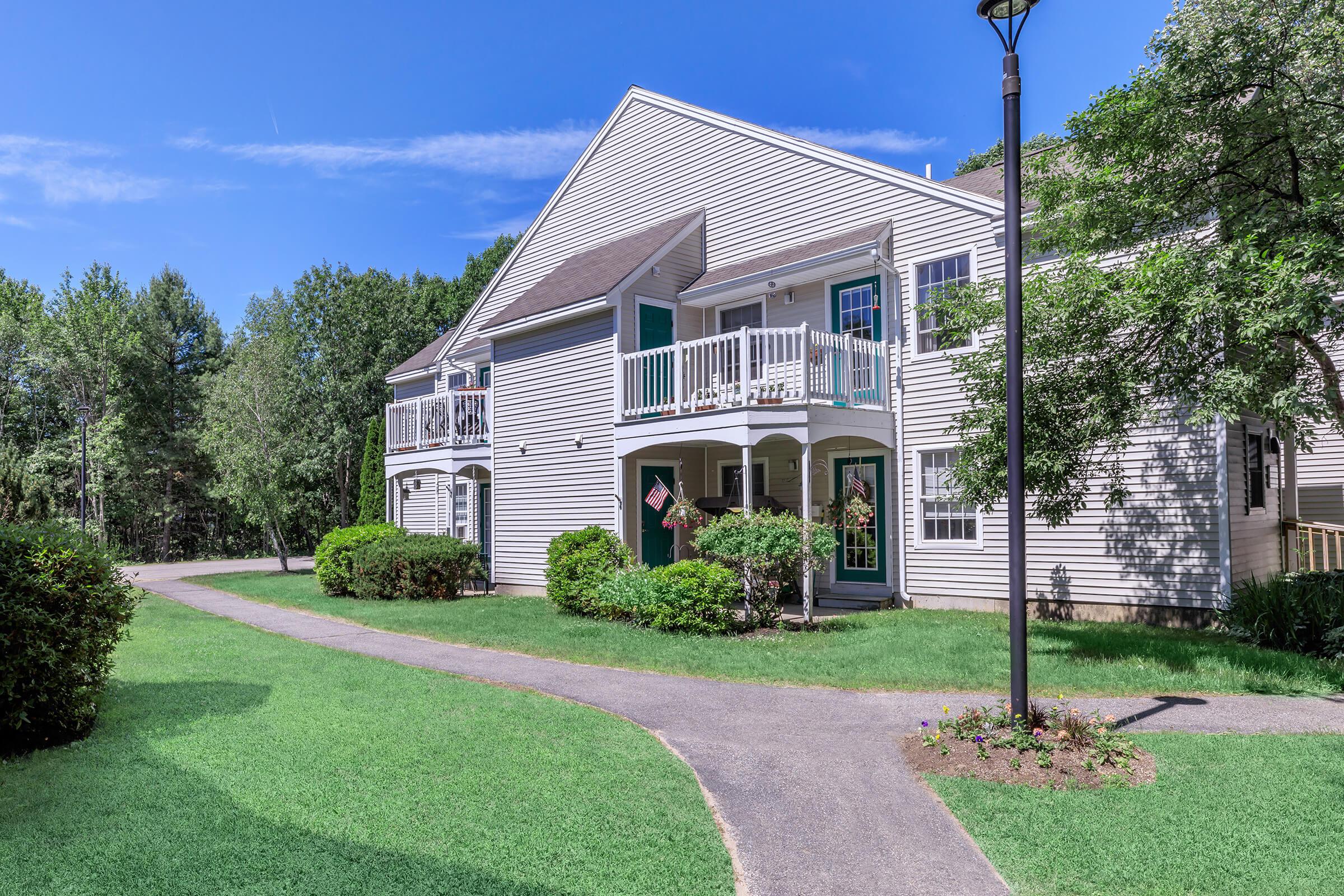 a large lawn in front of a house