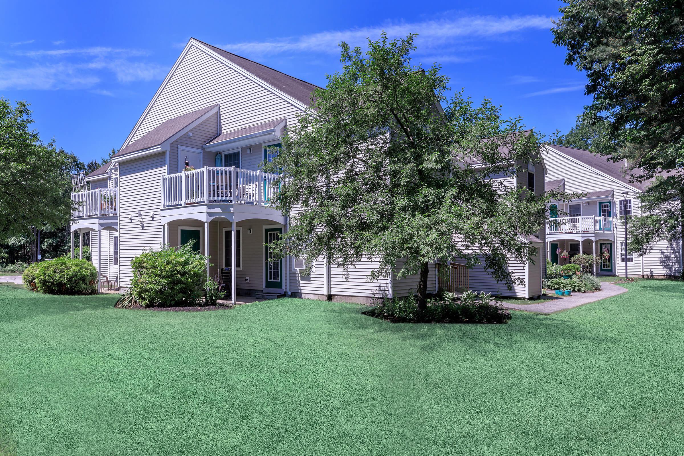 a large lawn in front of a house