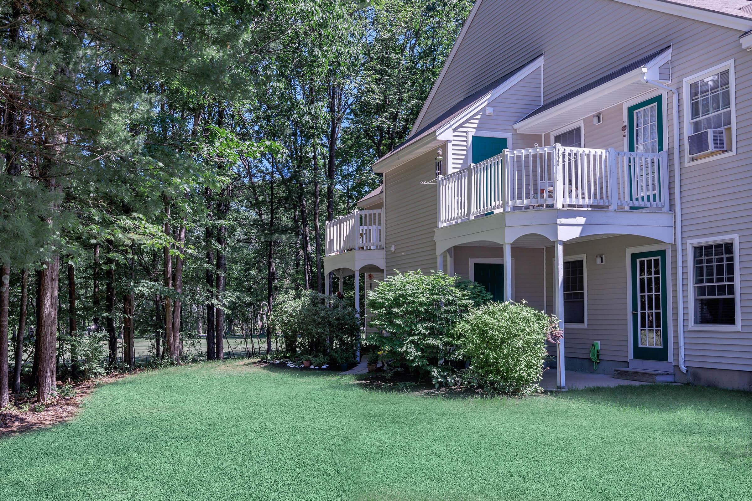 a large lawn in front of a house