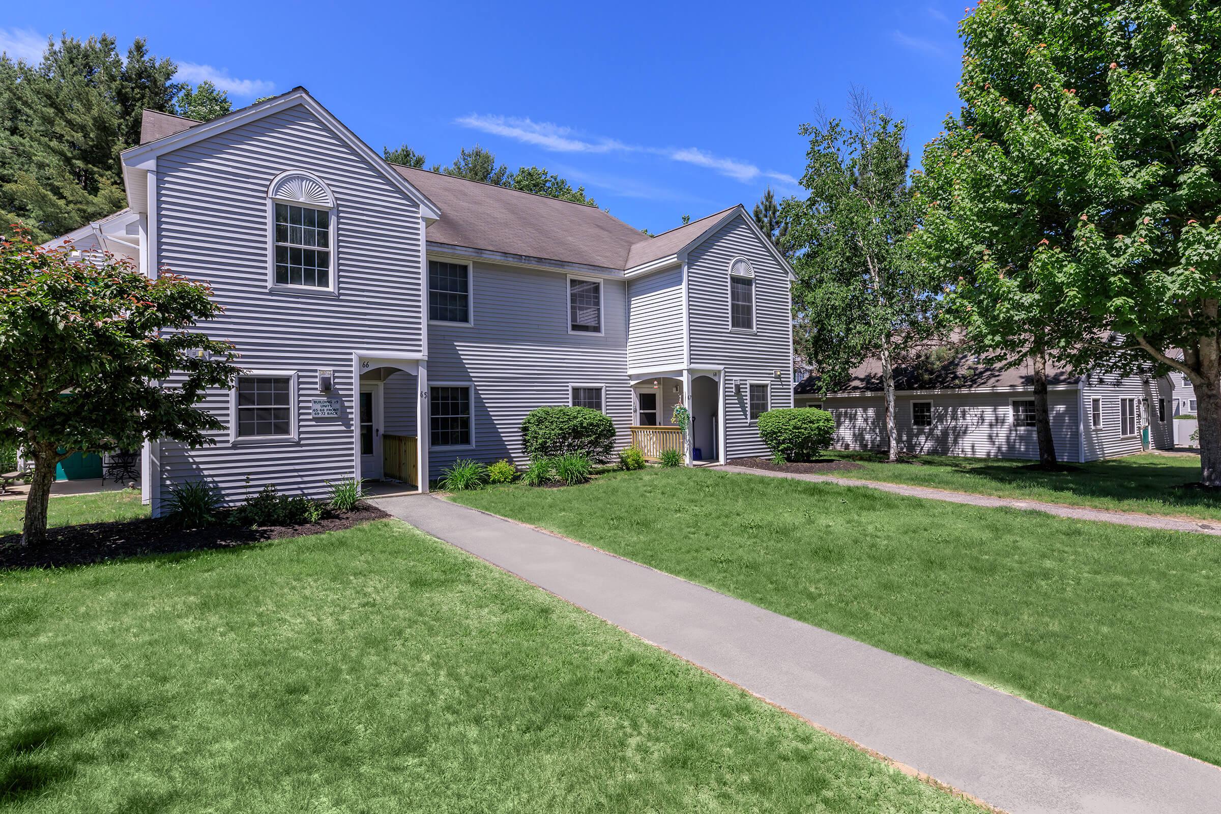 a large lawn in front of a house