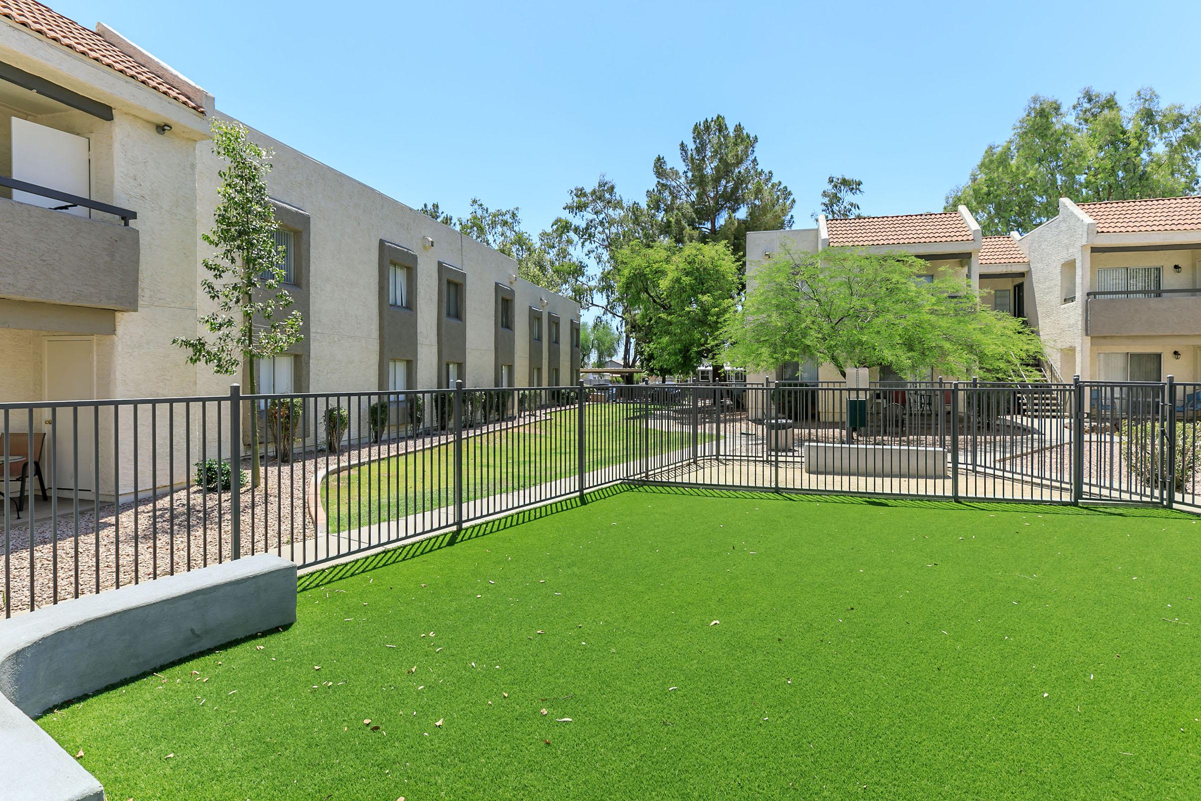 a building with a green lawn