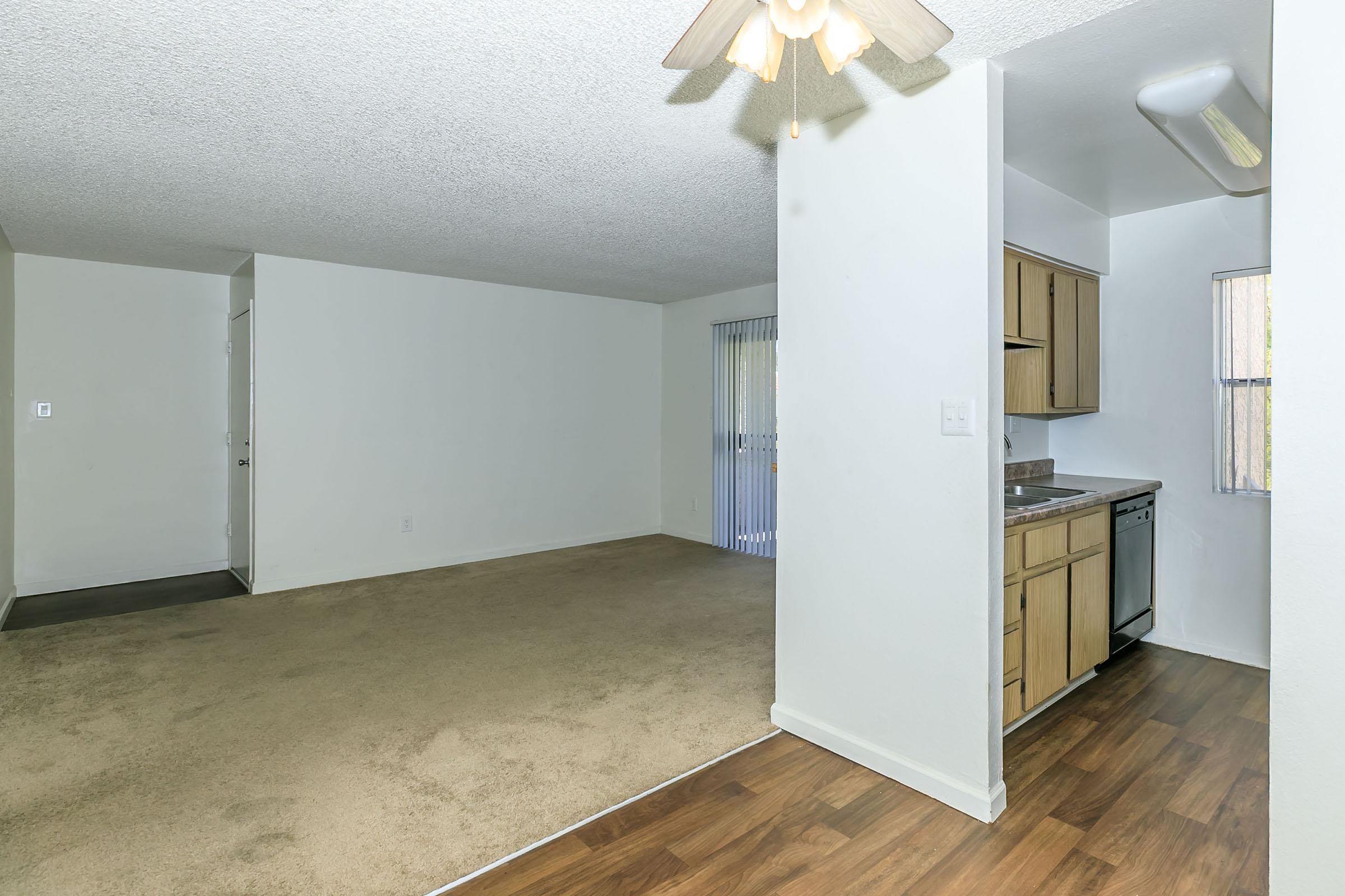 a kitchen with a wooden floor