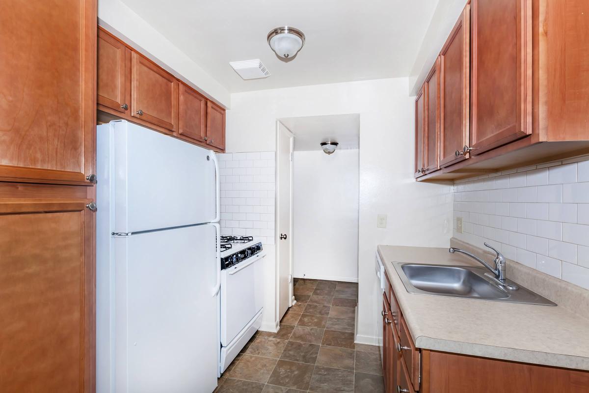 a kitchen with a sink and a refrigerator