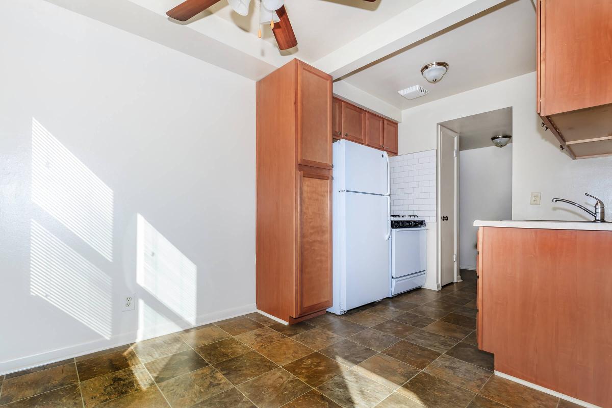 a kitchen with a sink and a refrigerator