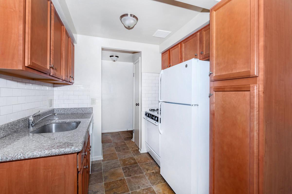 a kitchen with a sink and a refrigerator