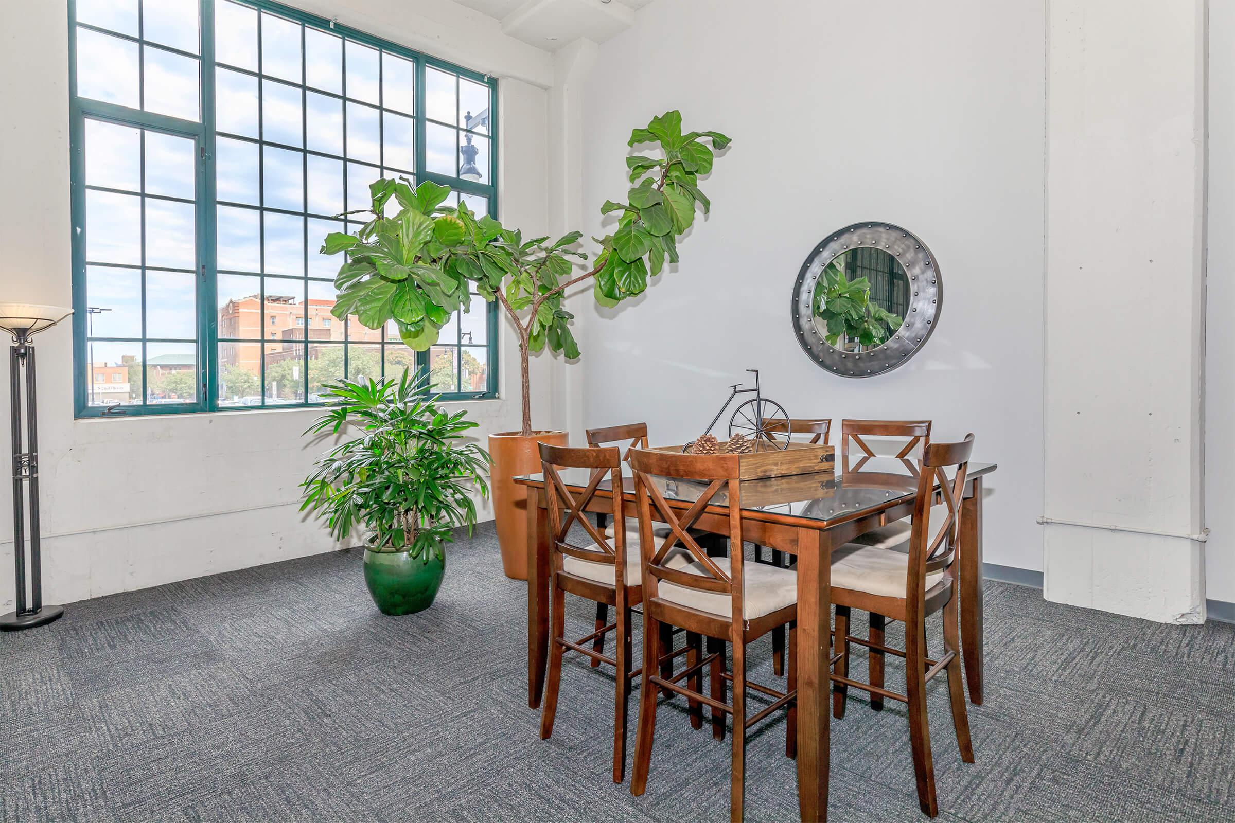 a dining room table in front of a window