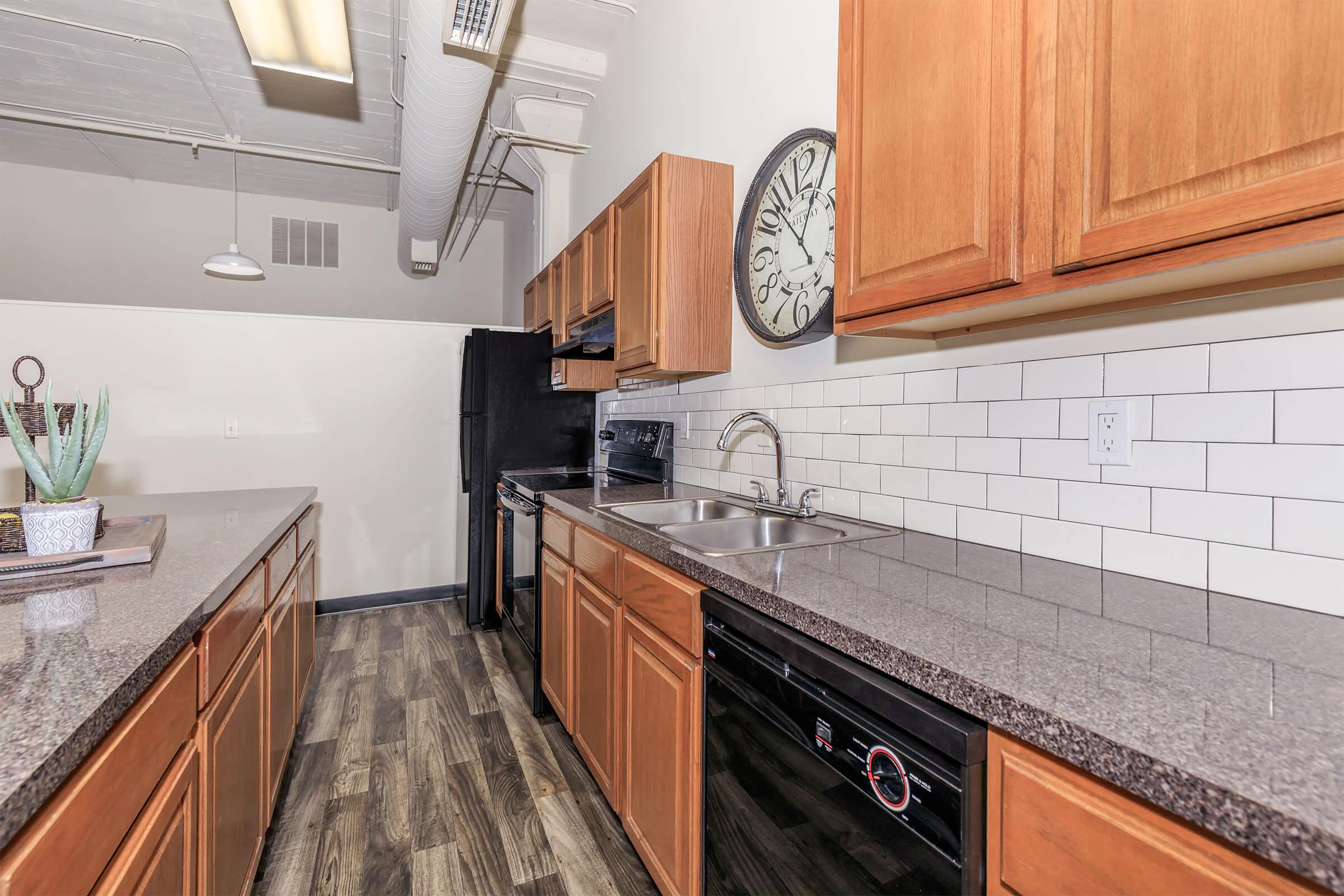 a kitchen with wooden cabinets