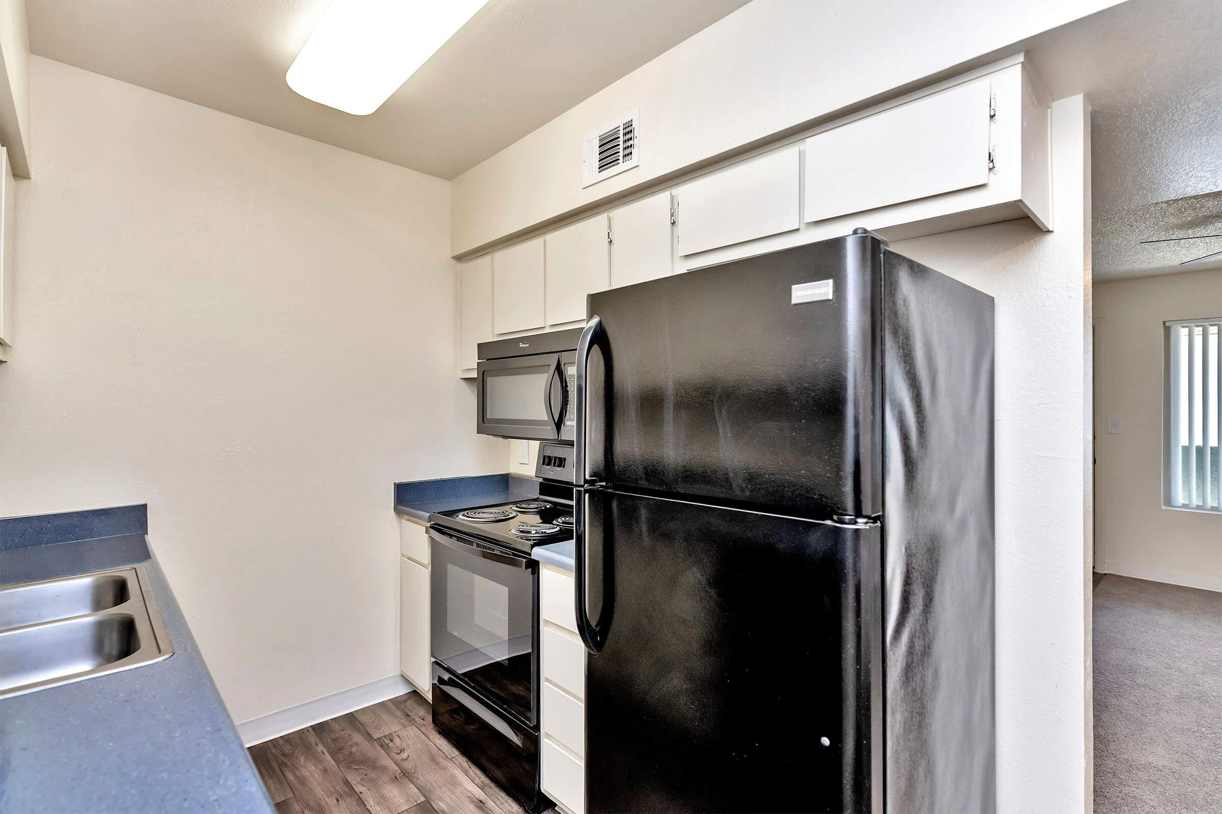 a stainless steel refrigerator in a kitchen