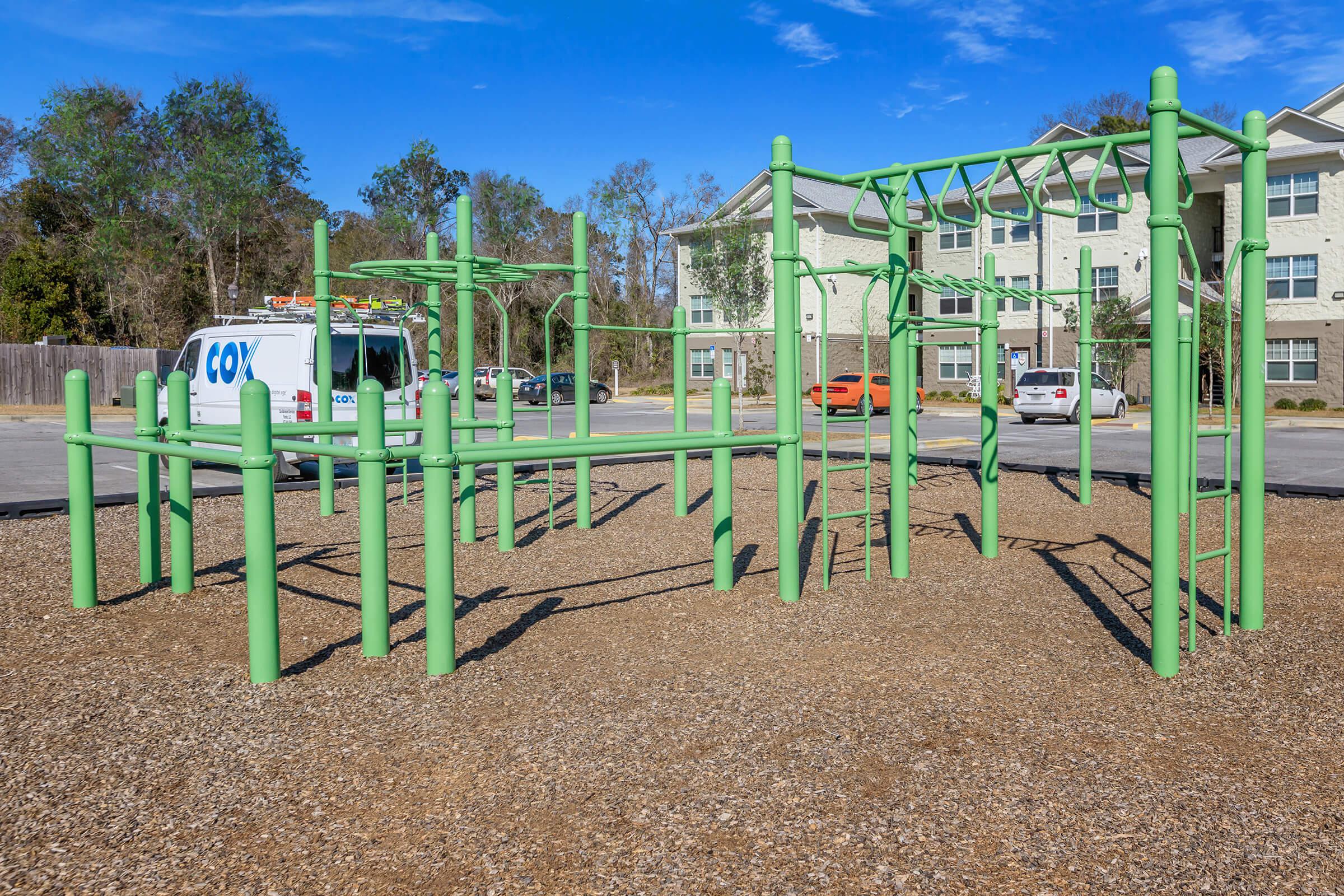 a playground in front of a fence