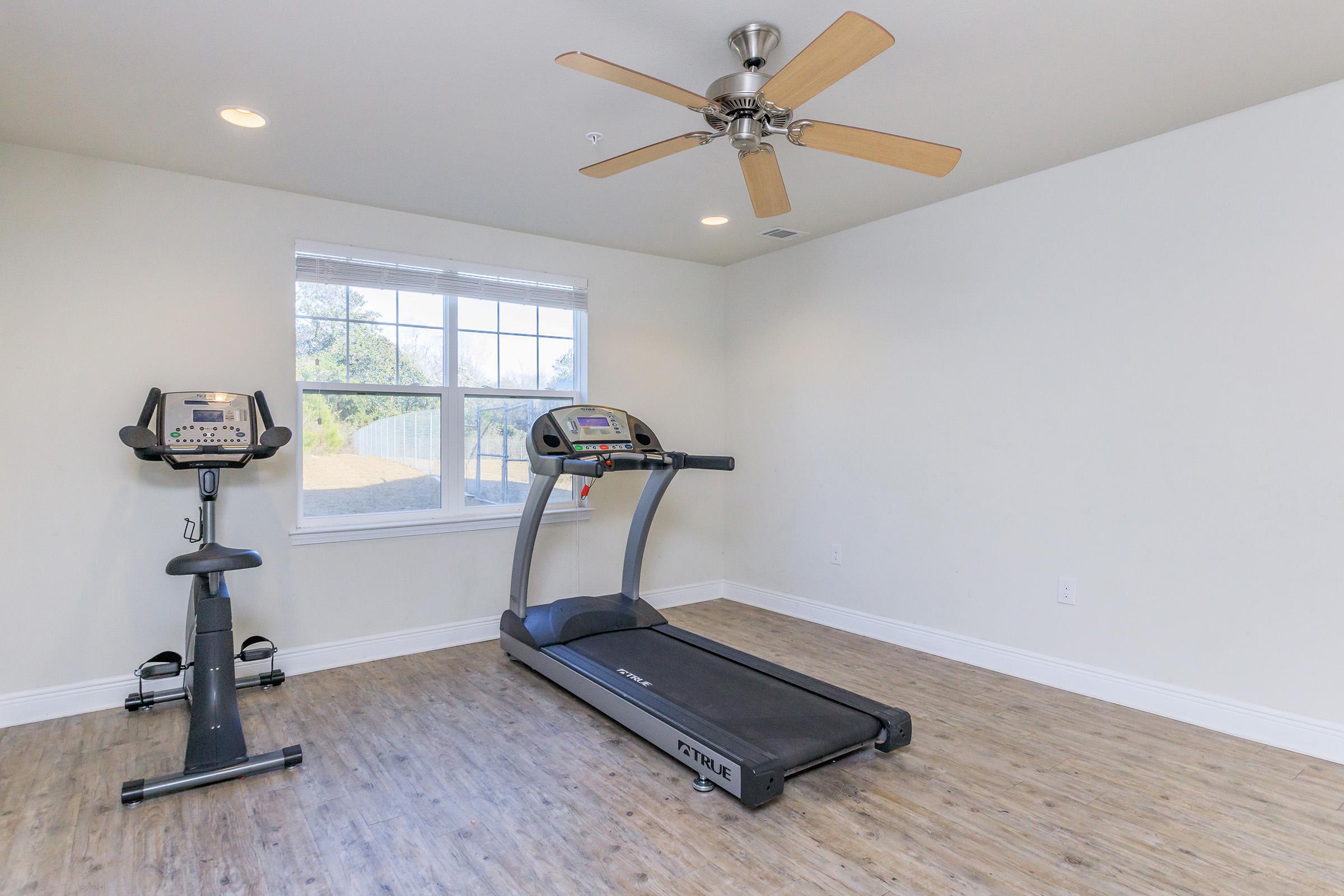 a desk with a laptop in a room