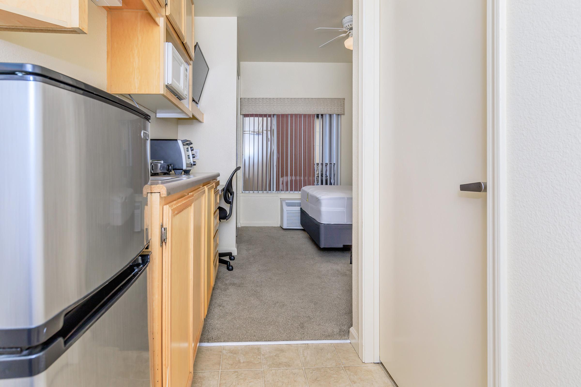 a kitchen with a sink and a refrigerator