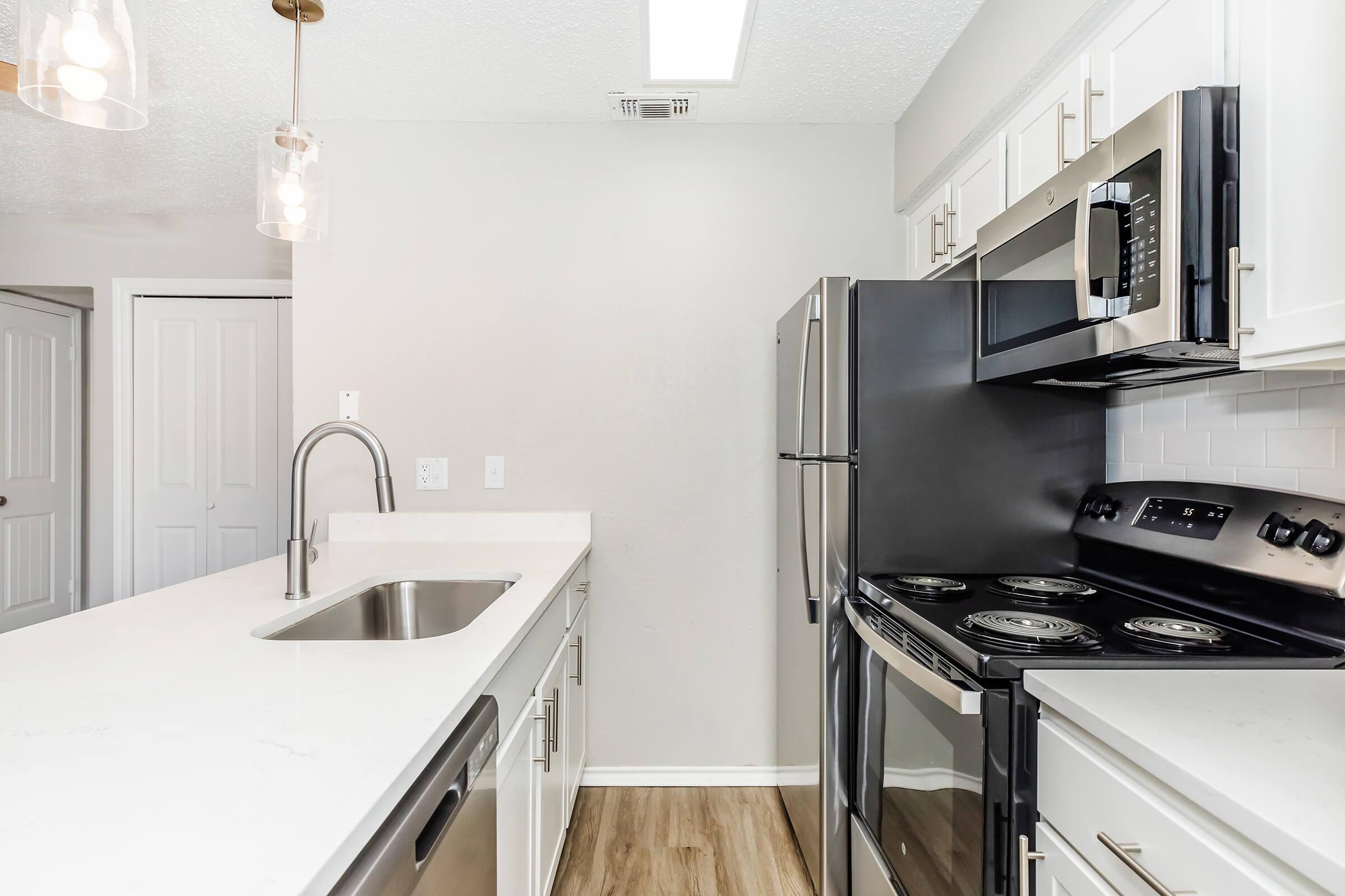 a kitchen with a stove top oven