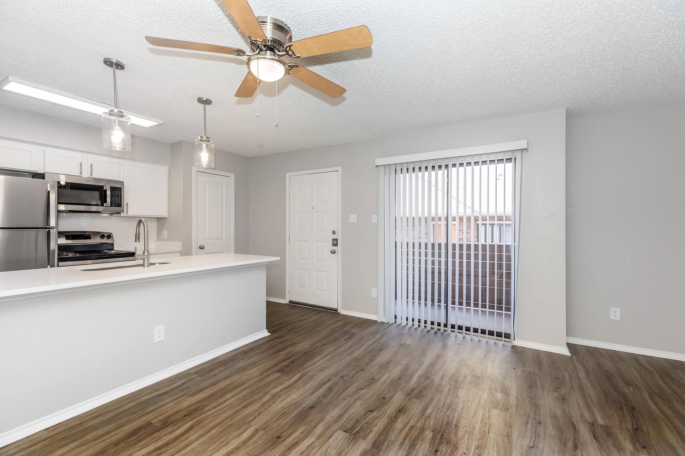 a kitchen with a wood floor