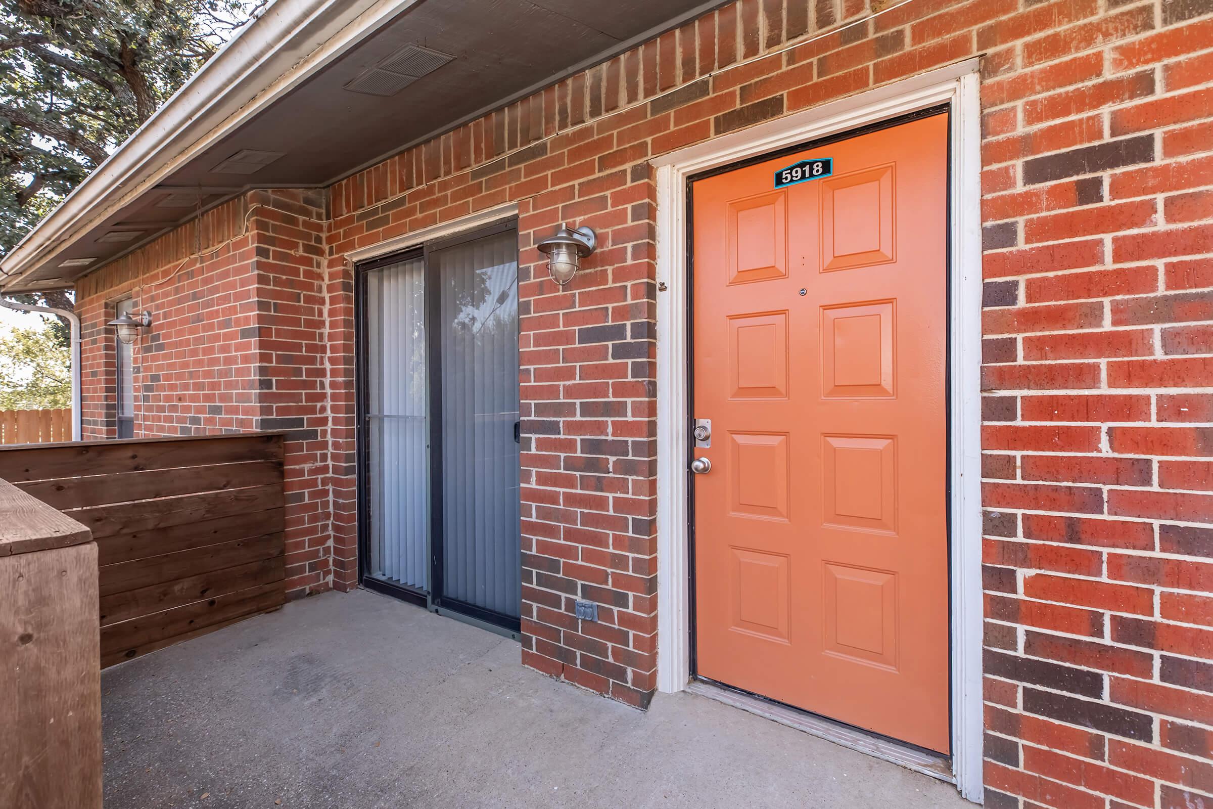 a door is open to a brick building