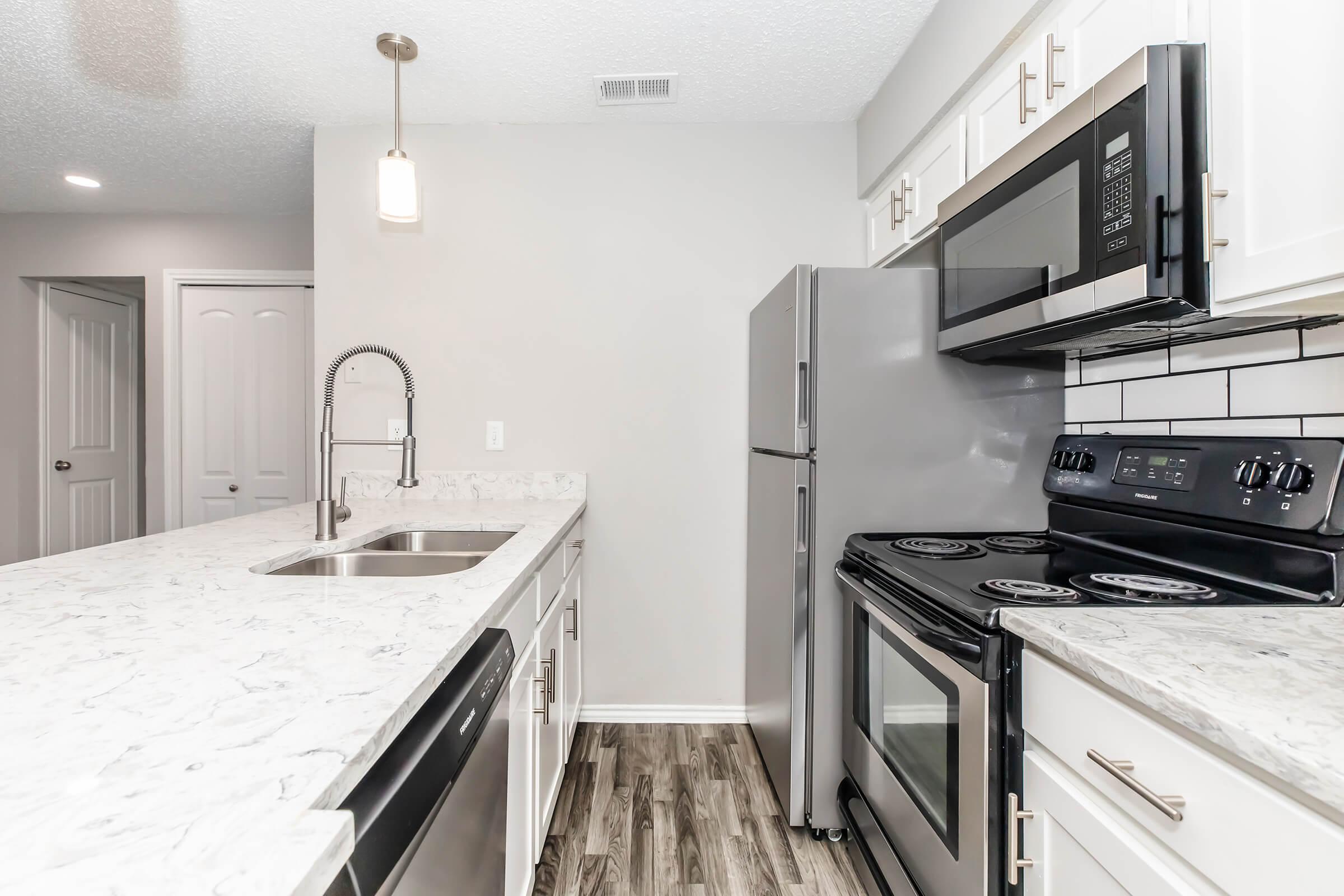 a kitchen with a stove top oven