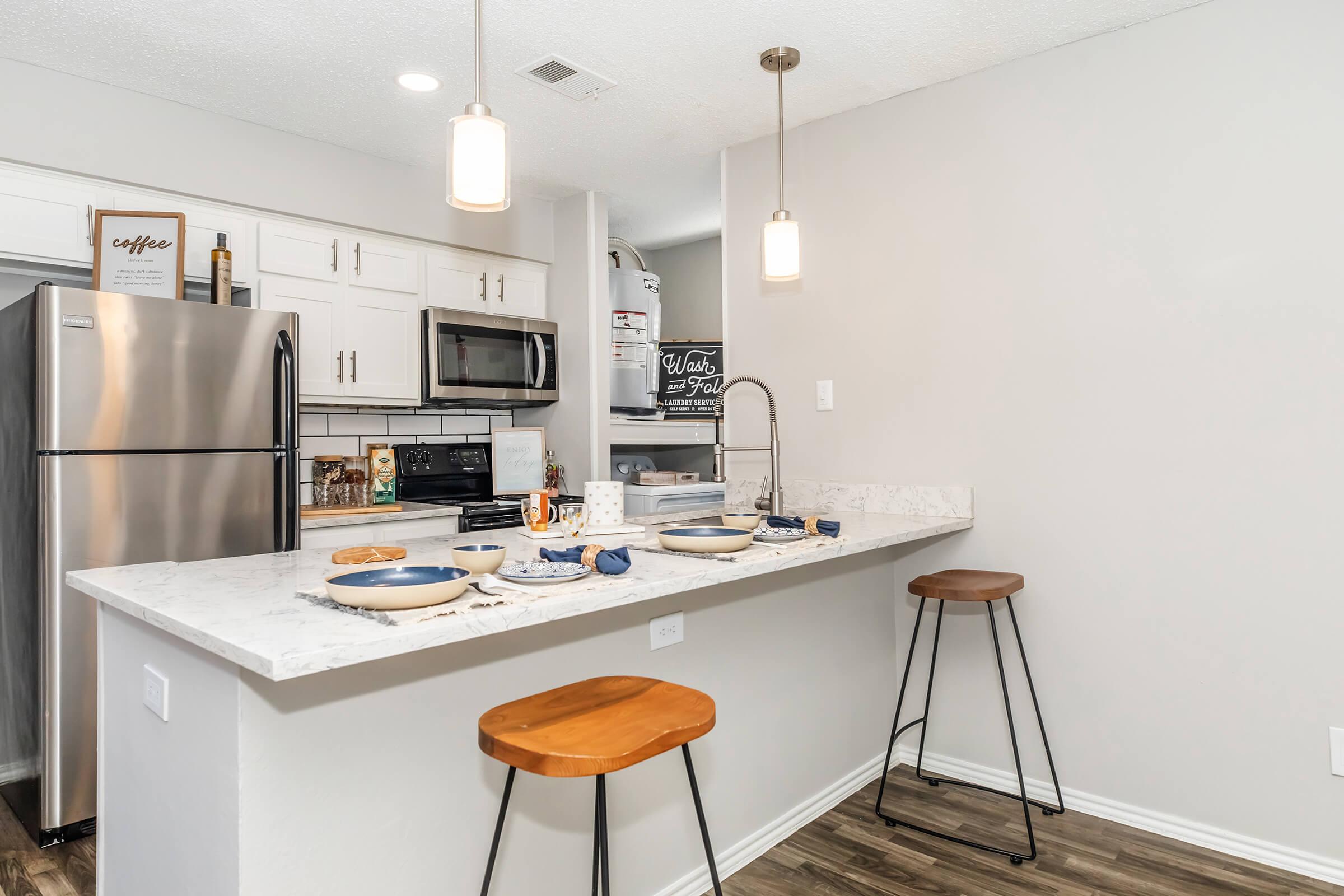 a kitchen with a table in a room