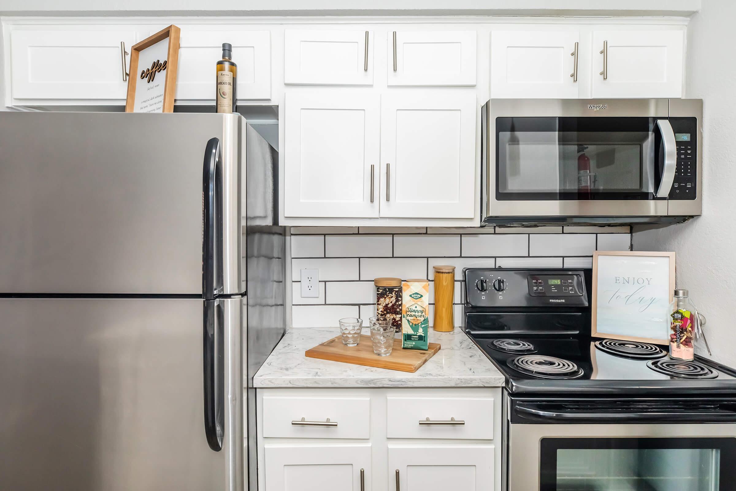 a kitchen with a stove top oven sitting inside of a refrigerator