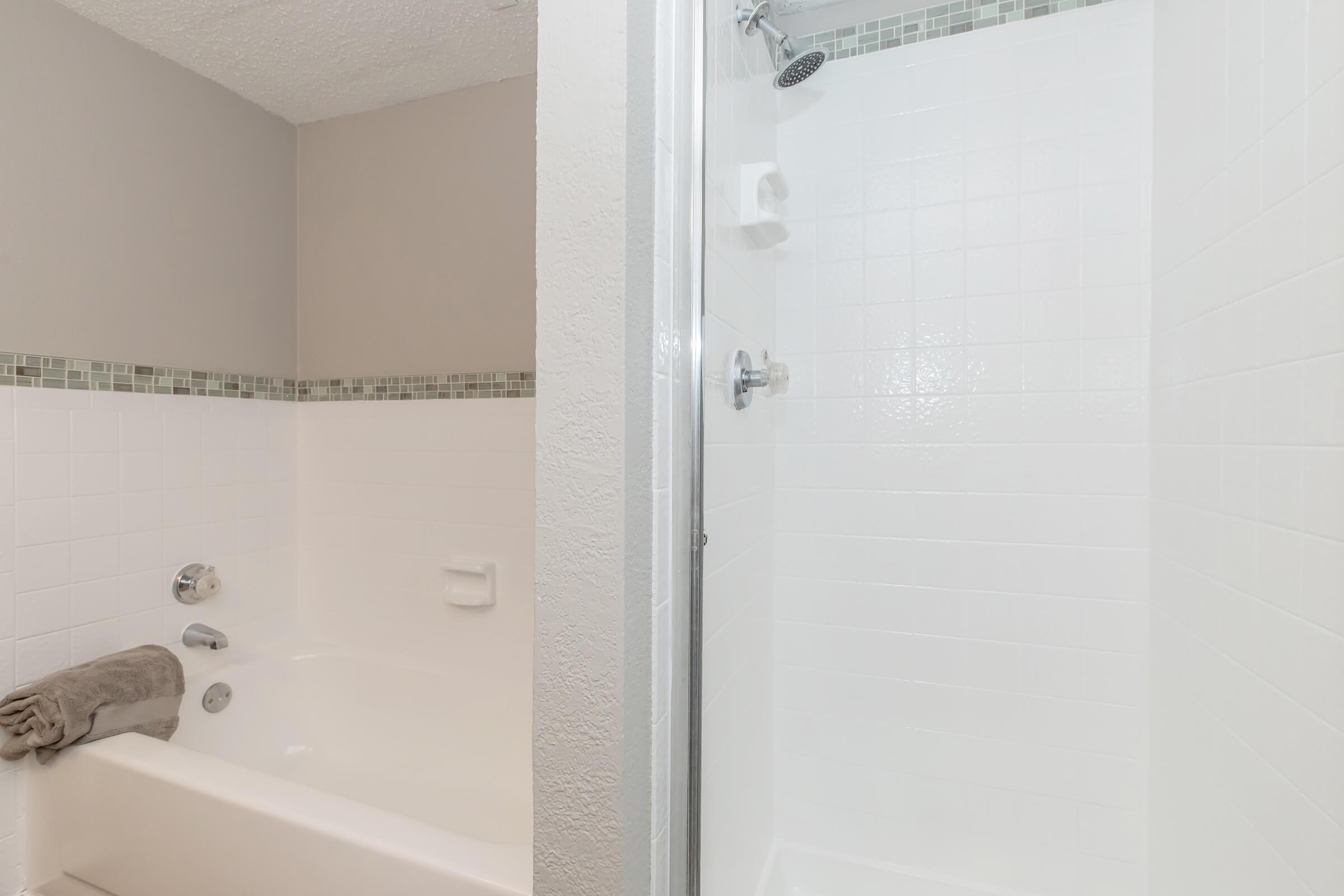 a room with a sink and a shower