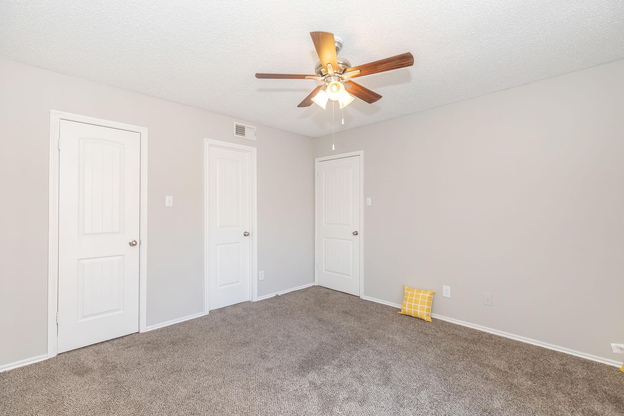 a bedroom with a large mirror