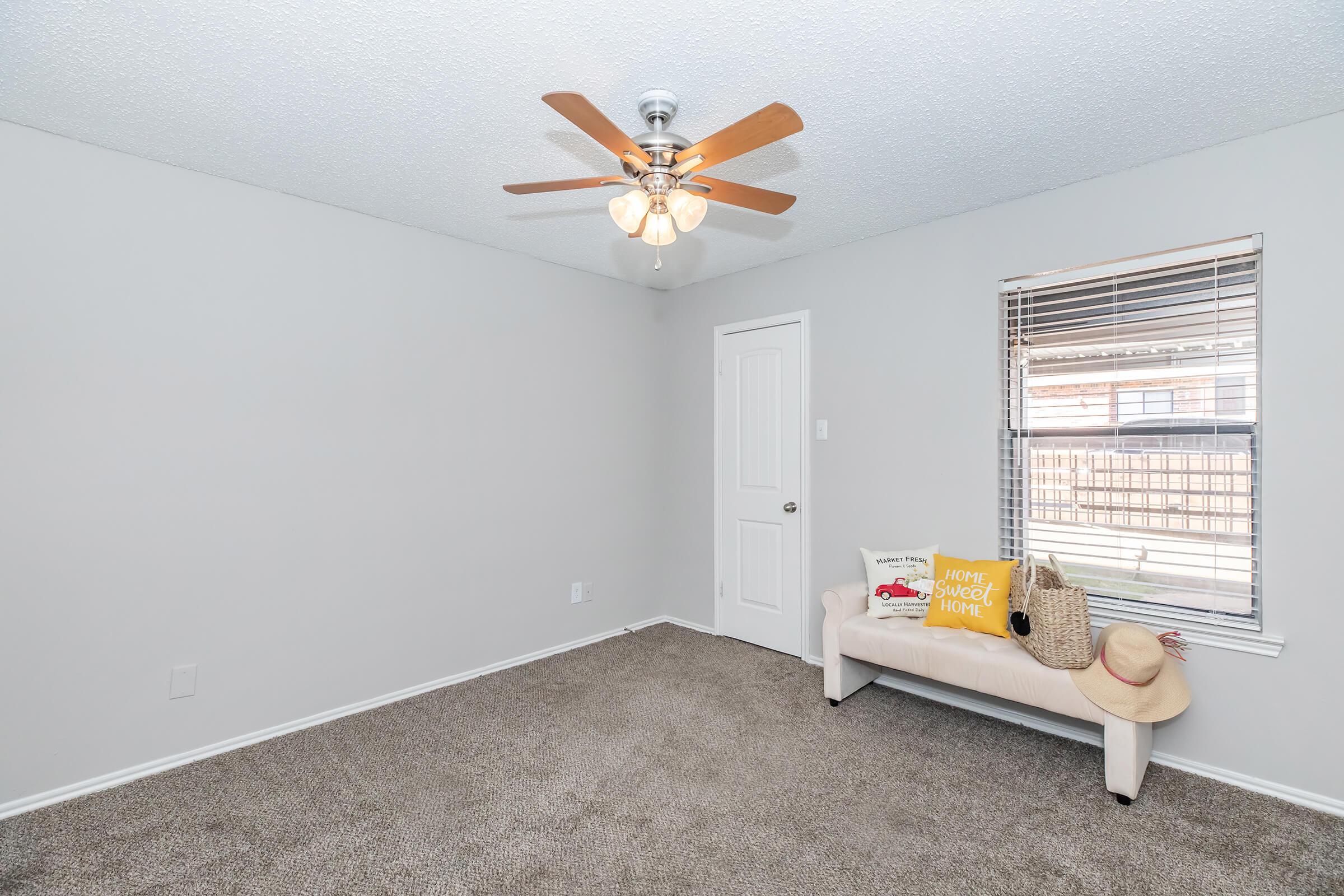 a bedroom with a large window