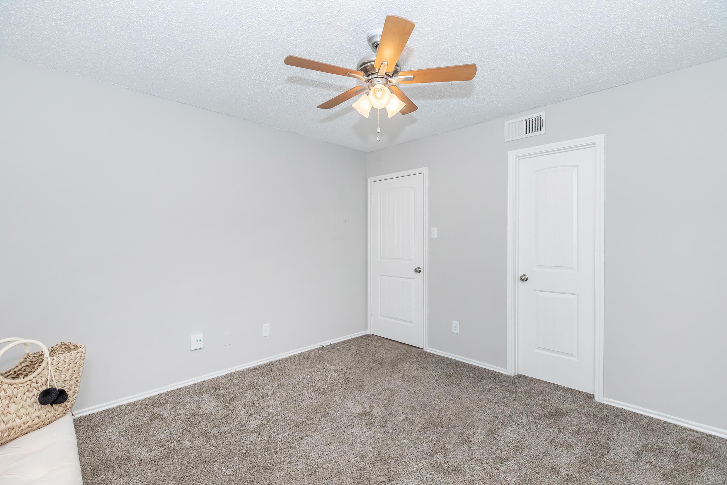 a bedroom with a large mirror