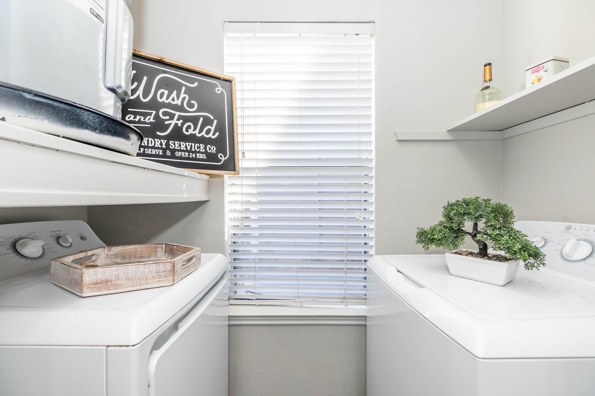 a kitchen with a sink and a refrigerator