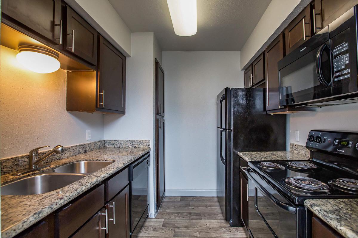 a large kitchen with stainless steel appliances