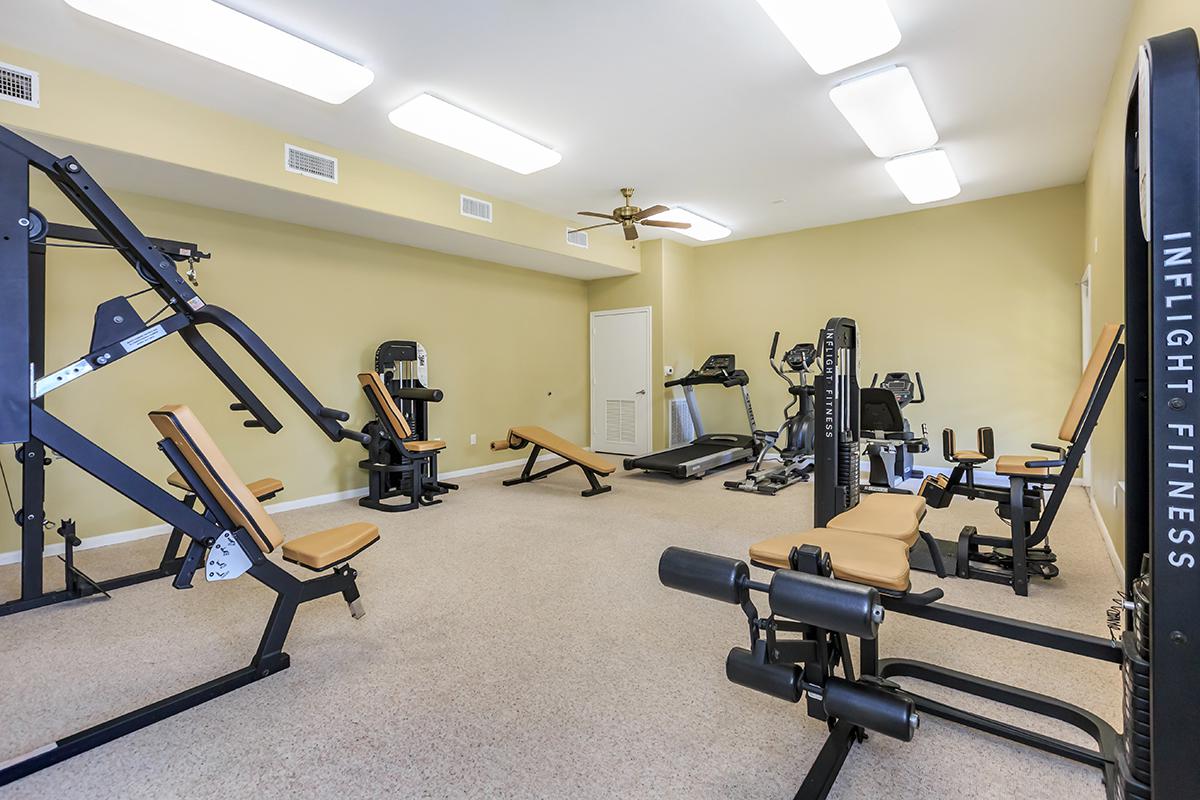 an office with a desk and chair in a room