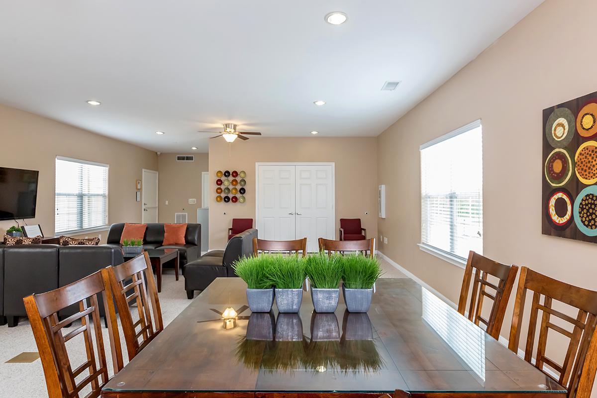 a view of a living room filled with furniture and a fireplace