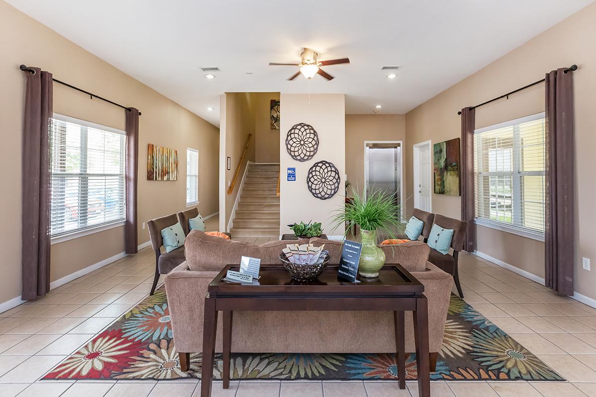 a living room filled with furniture and a fire place