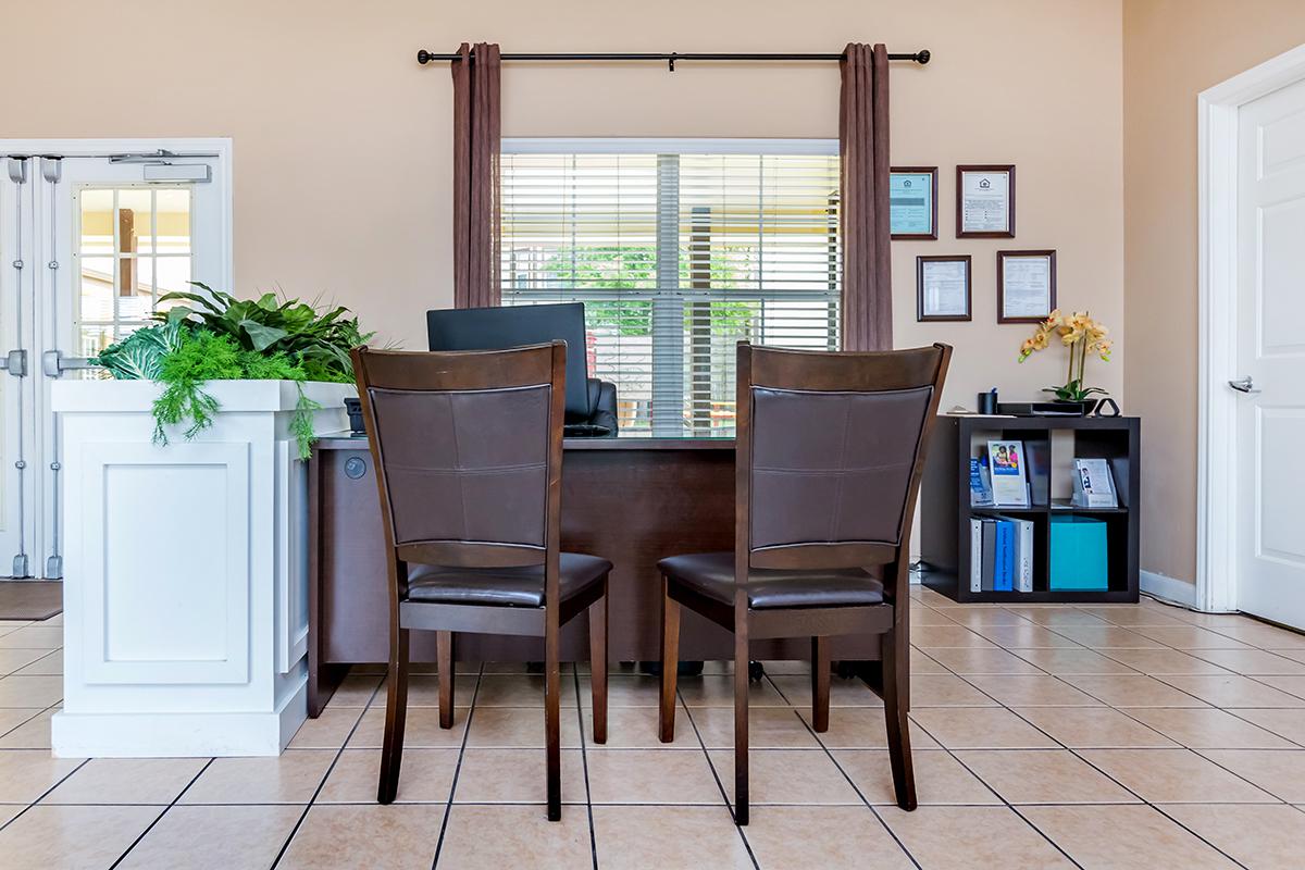 a dining room table in front of a window